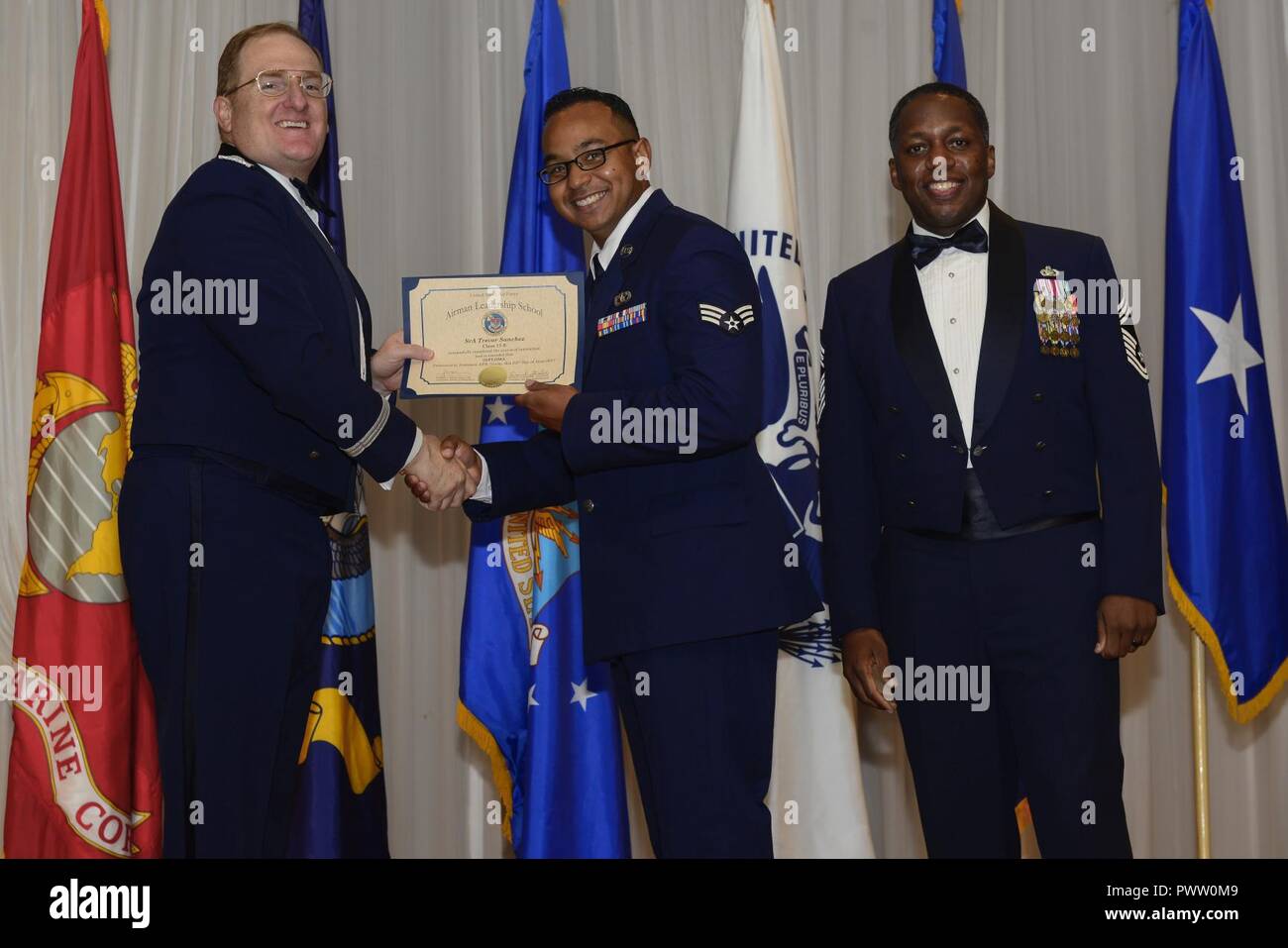 U.S. Air Force Senior Airman Trevor Sanchez receives their graduation ...