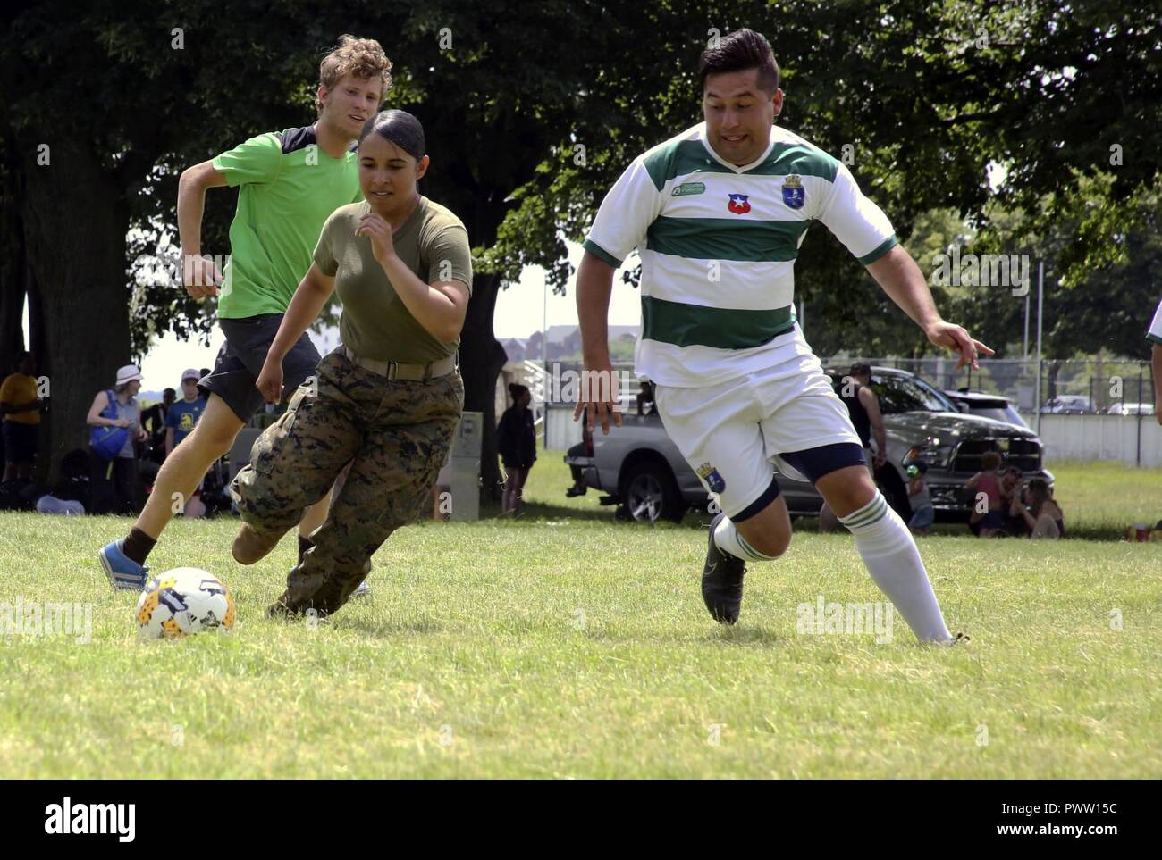 Lance Cpl. Jailine Martinez sprints for the ball during the Sail Boston 2017 Soccer Tournament held at Joe Moakley Park in Boston, Mass., June 20, 2017. The tournament was a friendly competition aimed at establishing rapport among service members from around the world and others participating in Sail Boston. Marines and Sailors from countries including Chile, Peru, and Ecuador attended the tournament. Martinez is a combat photographer assigned to Marine Wing Headquarters Squadron 2, Marine Aircraft Group 14, 2nd Marine Aircraft Wing. Stock Photo
