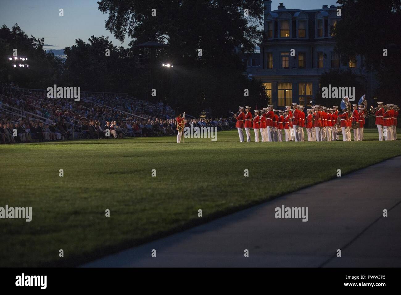 U.S. Marines with 'The Presidents Own' United States Marine Band perform during an evening parade at Marine Barracks Washington, Washington, D.C., June 23, 2017. Evening parades are held as a means of honoring senior officials, distinguished citizens and supporters of the Marine Corps. Stock Photo