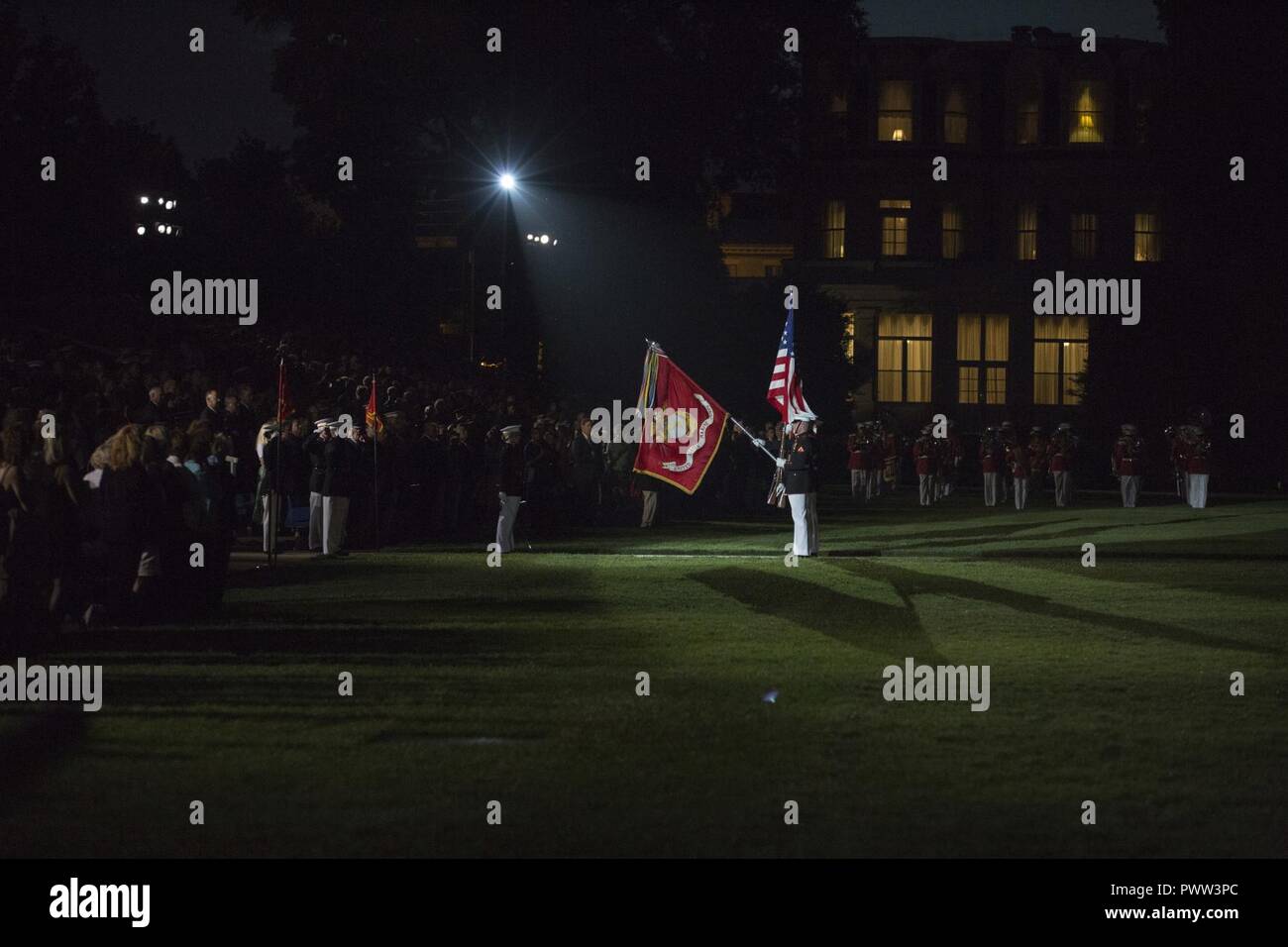 U.S. Marines with the official Marine Corps Color Guard present colors during an evening parade at Marine Barracks Washington, Washington, D.C., June 23, 2017. Evening parades are held as a means of honoring senior officials, distinguished citizens and supporters of the Marine Corps. Stock Photo