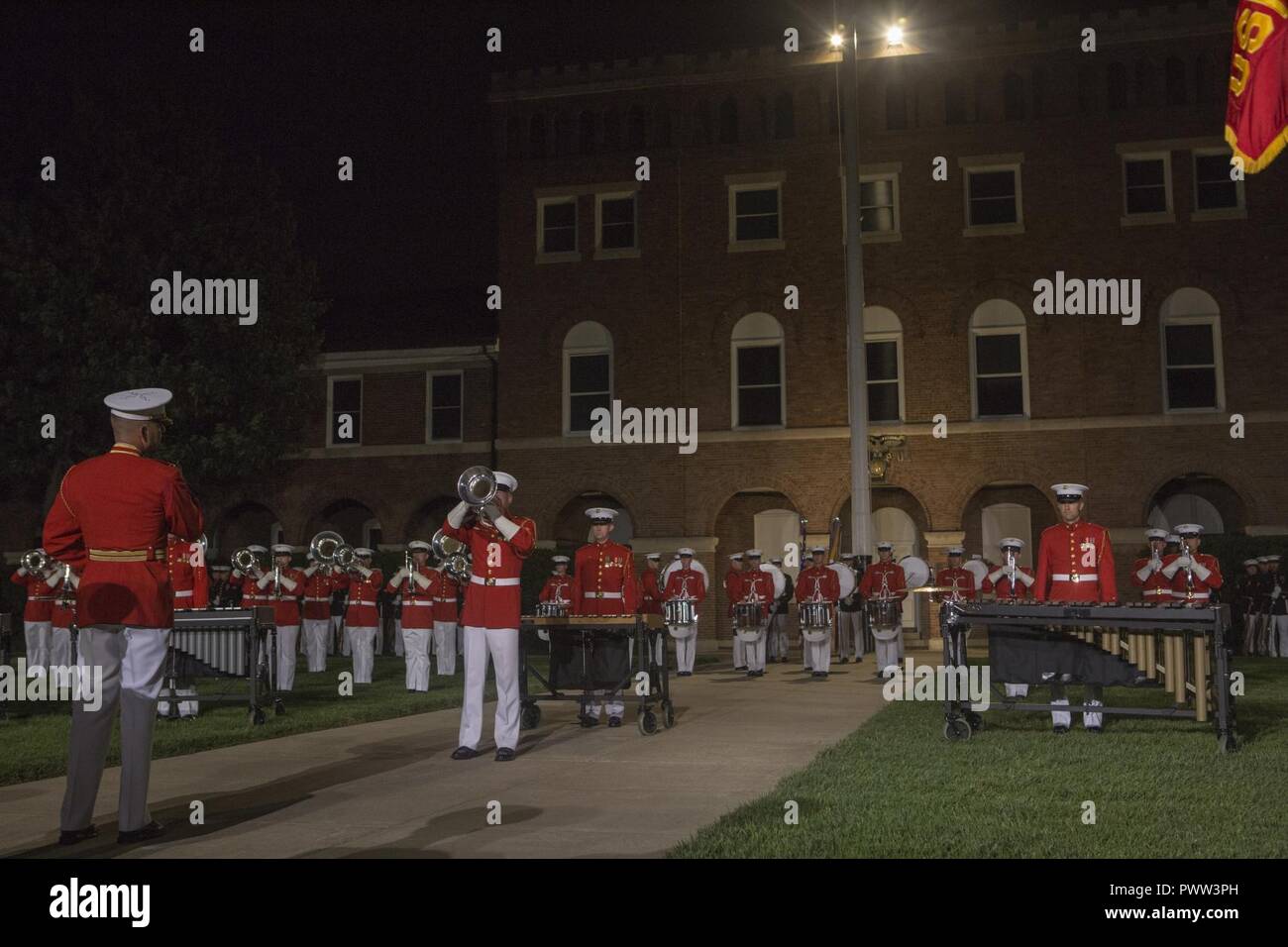 U.S. Marines with the U.S. Marine Drum and Bugle Corps perform during an evening parade at Marine Barracks Washington, Washington, D.C., June 9, 2017. Evening parades are held as a means of honoring senior officials, distinguished citizens and supporters of the Marine Corps. Stock Photo