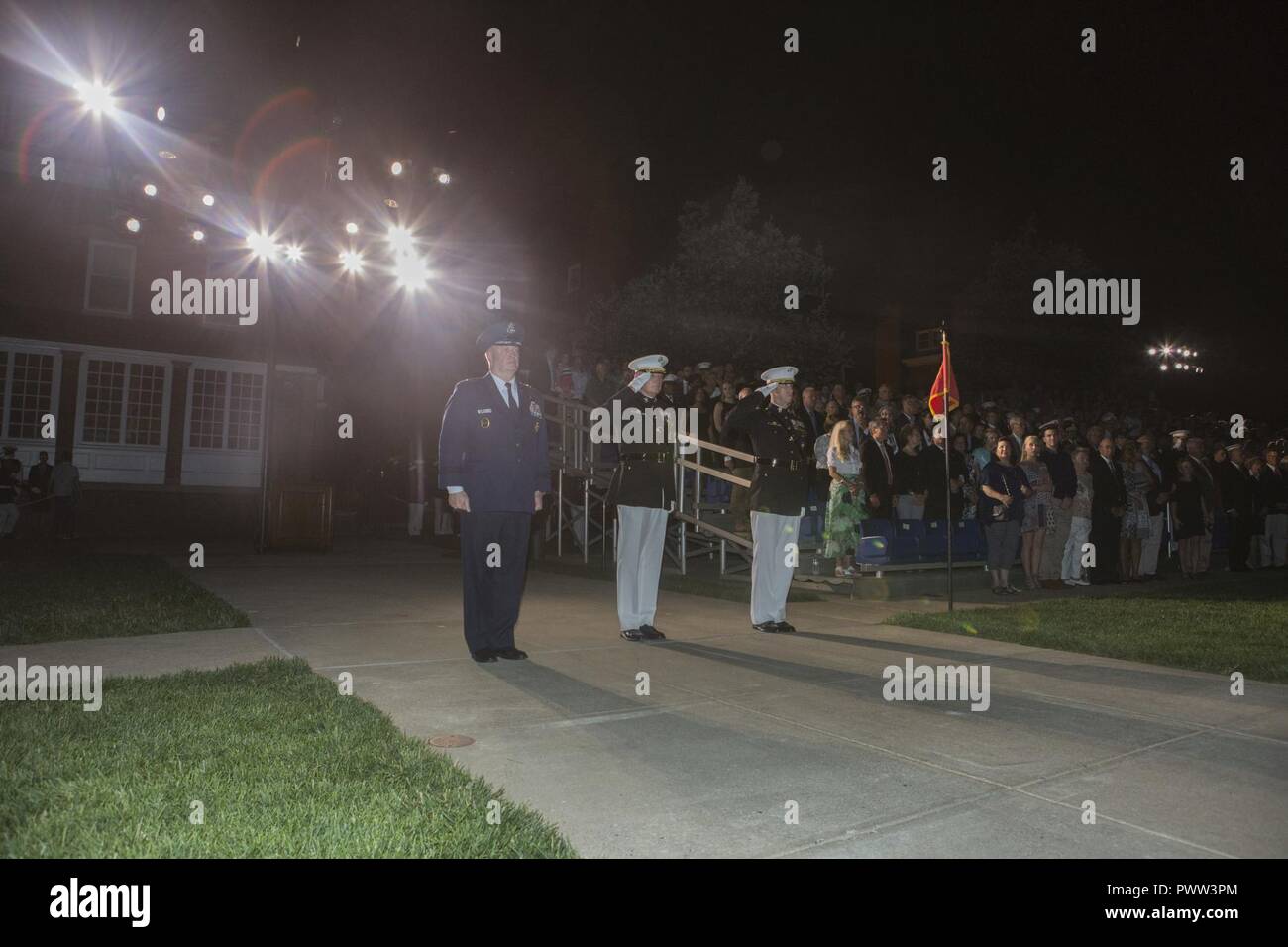 From left, U.S. Air Force Lt. Gen. Thomas J. Trask, vice commander of Headquarters U.S. Special Operations Command (SOCOM); Director Marine Corps Staff Lt. Gen. James B. Laster; and Col. Tyler J. Zagurski, commanding officer, Marine Barracks Washington, render honors during an evening parade at Marine Barracks Washington, Washington, D.C., June 23, 2017. Evening parades are held as a means of honoring senior officials, distinguished citizens and supporters of the Marine Corps. Stock Photo