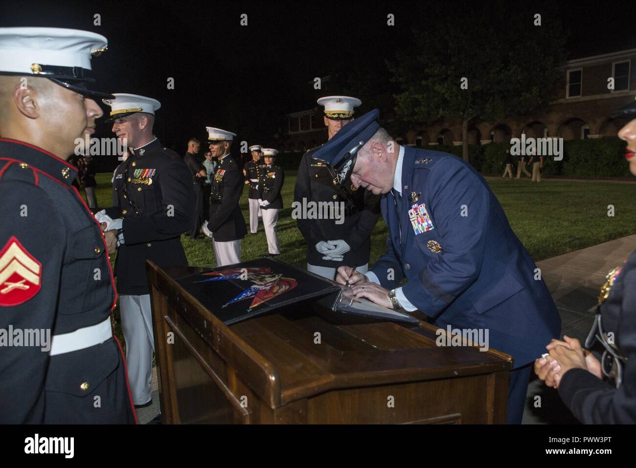 U.S. Air Force Lt. Gen. Thomas J. Trask, vice commander of Headquarters U.S. Special Operations Command (SOCOM), signs a guest book after an evening parade at Marine Barracks Washington, Washington, D.C., June 23, 2017. Evening parades are held as a means of honoring senior officials, distinguished citizens and supporters of the Marine Corps. Stock Photo