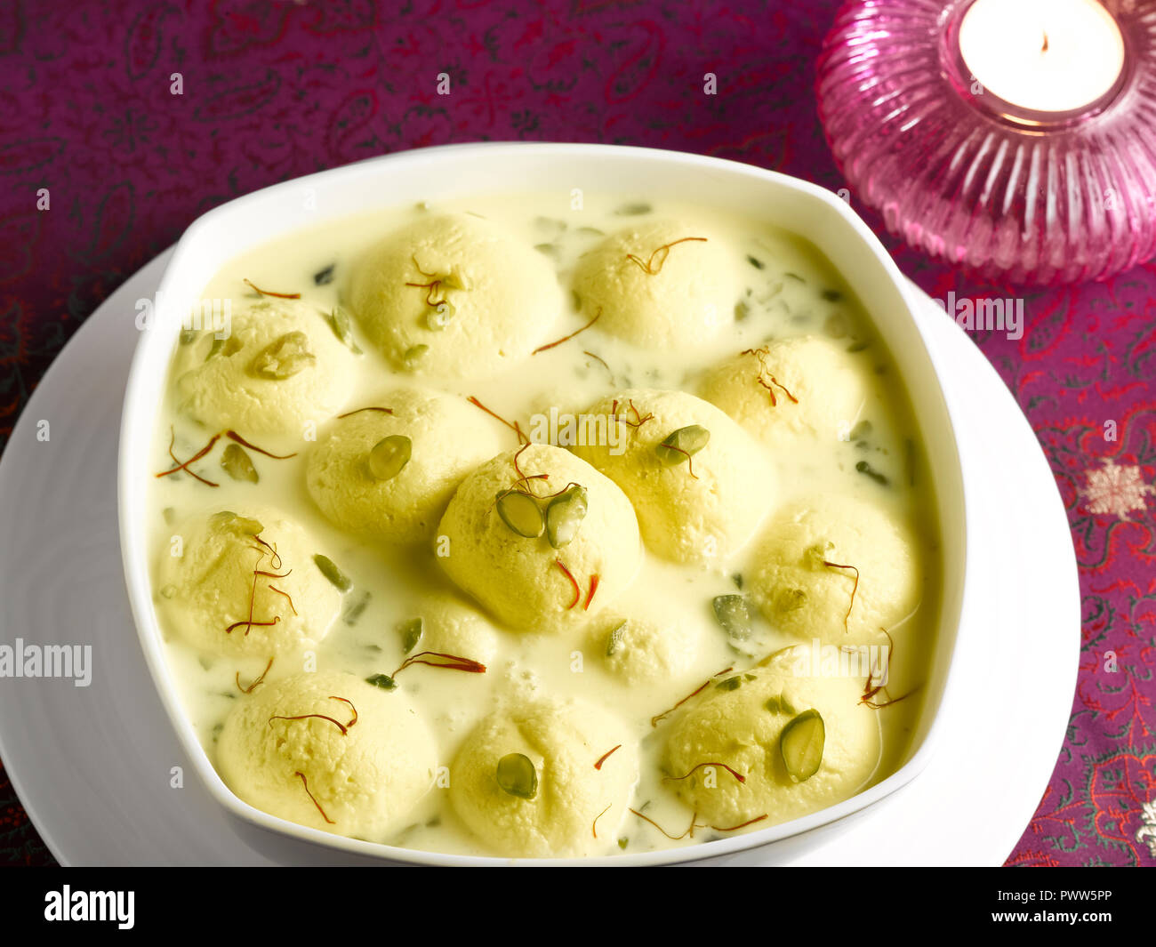 RASMALAI, AN INDIAN DESSERT MADE FROM COTTAGE CHEESE SOAKED IN SWEET