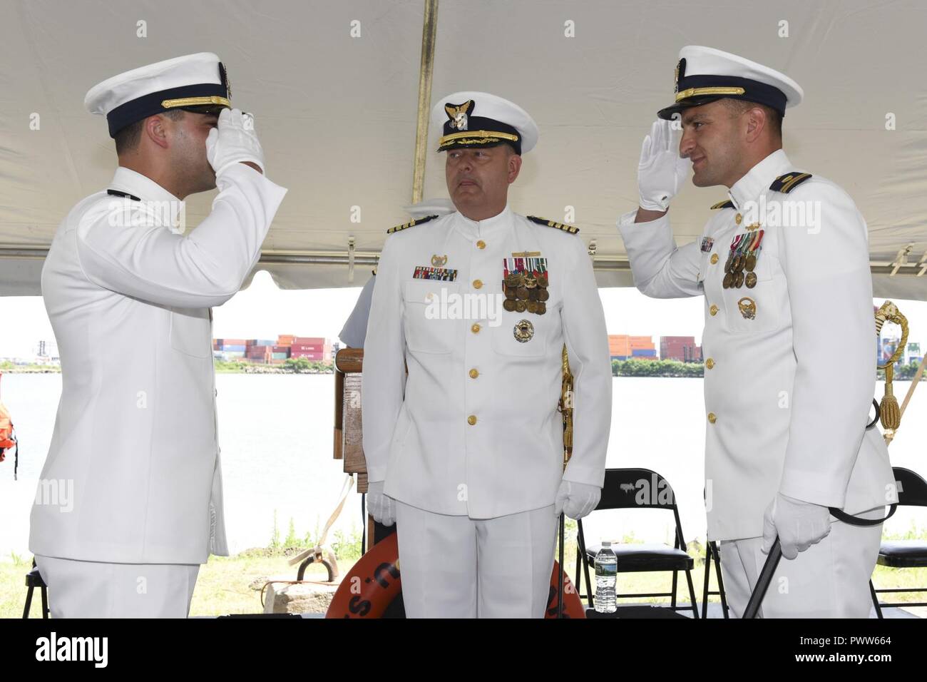 NEW YORK - Coast Guard Lt. Cmdr. Paul Windt (left) salutes Lt. Keith ...