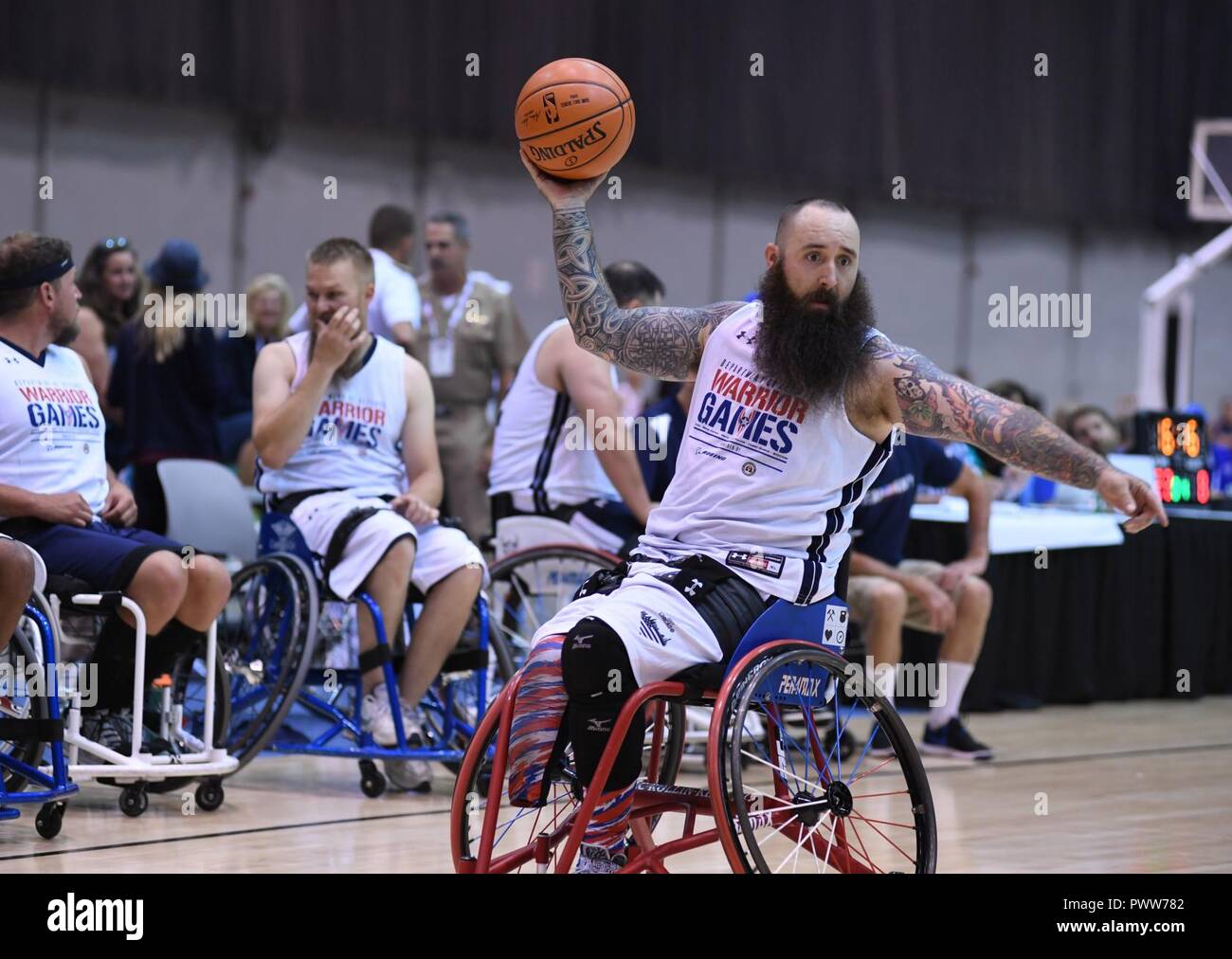 CHICAGO (June 30, 2017) Retired Aviation Electrician's Mate Airman Steve Davis, a native of Modesto, Calif., participates in the wheelchair basketball portion for Team Navy during the 2017 Warrior Games at McCormick Place in Chicago. Team Navy is comprised of athletes from Navy Wounded Warrior - Safe Harbor, the Navy's sole organization for coordinating the non-medical care of seriously wounded, ill, and injured Sailors and Coast Guard members, providing resources and support to their families. ( Stock Photo