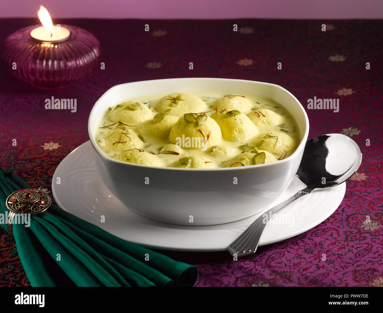 Indian sweet kesar rasmalai garnish hi-res stock photography and images ...