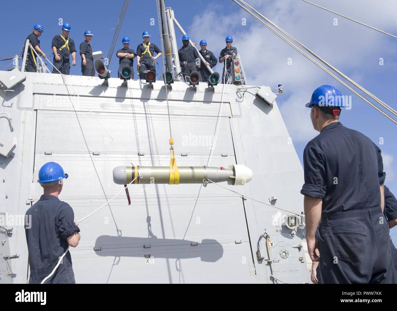 WATERS OFF GUAM (June 28, 2017) Sailors hoist an MK 46 torpedo from the ...