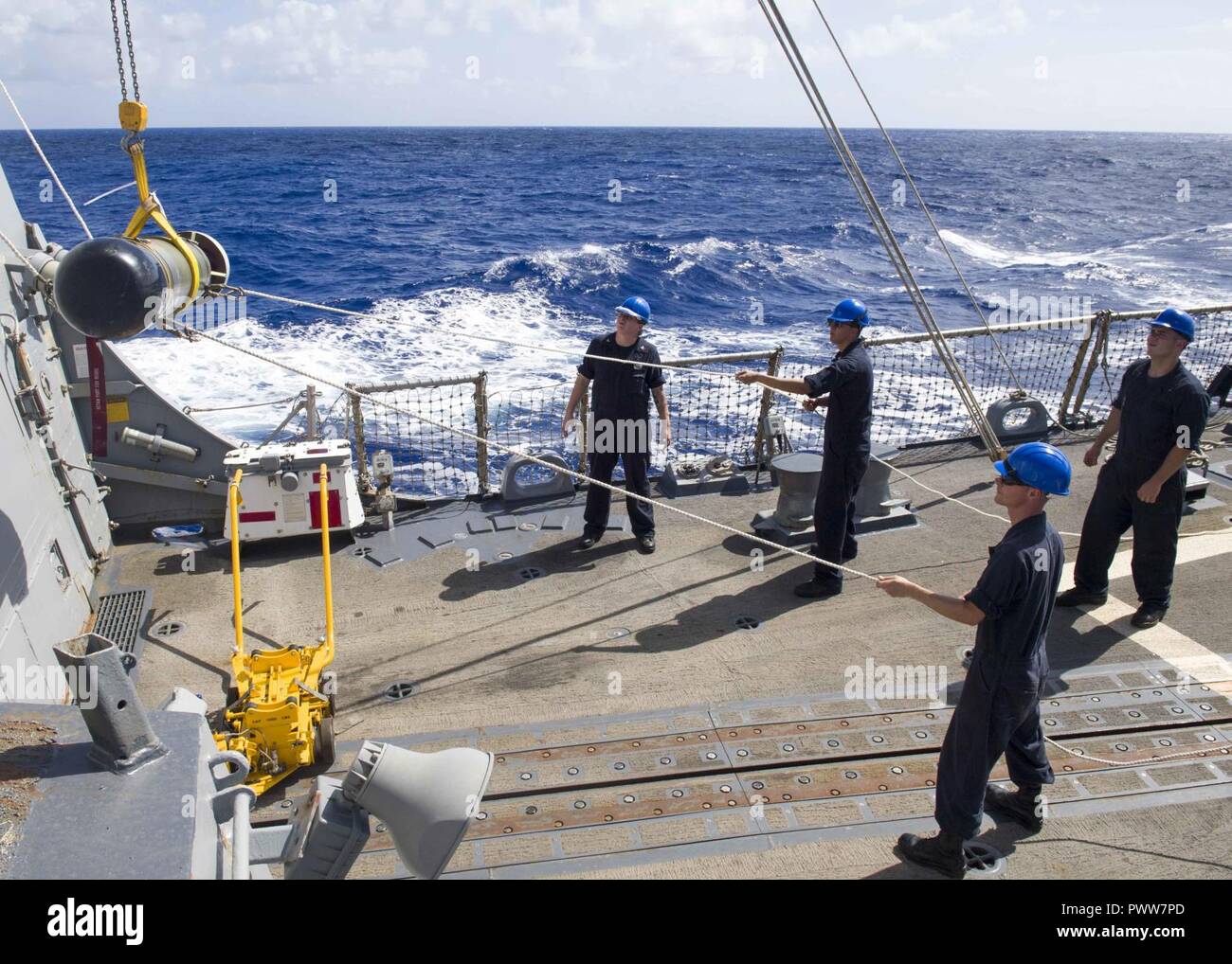 WATERS OFF GUAM (June 28, 2017) Sailors hoist an MK 46 torpedo from the ...