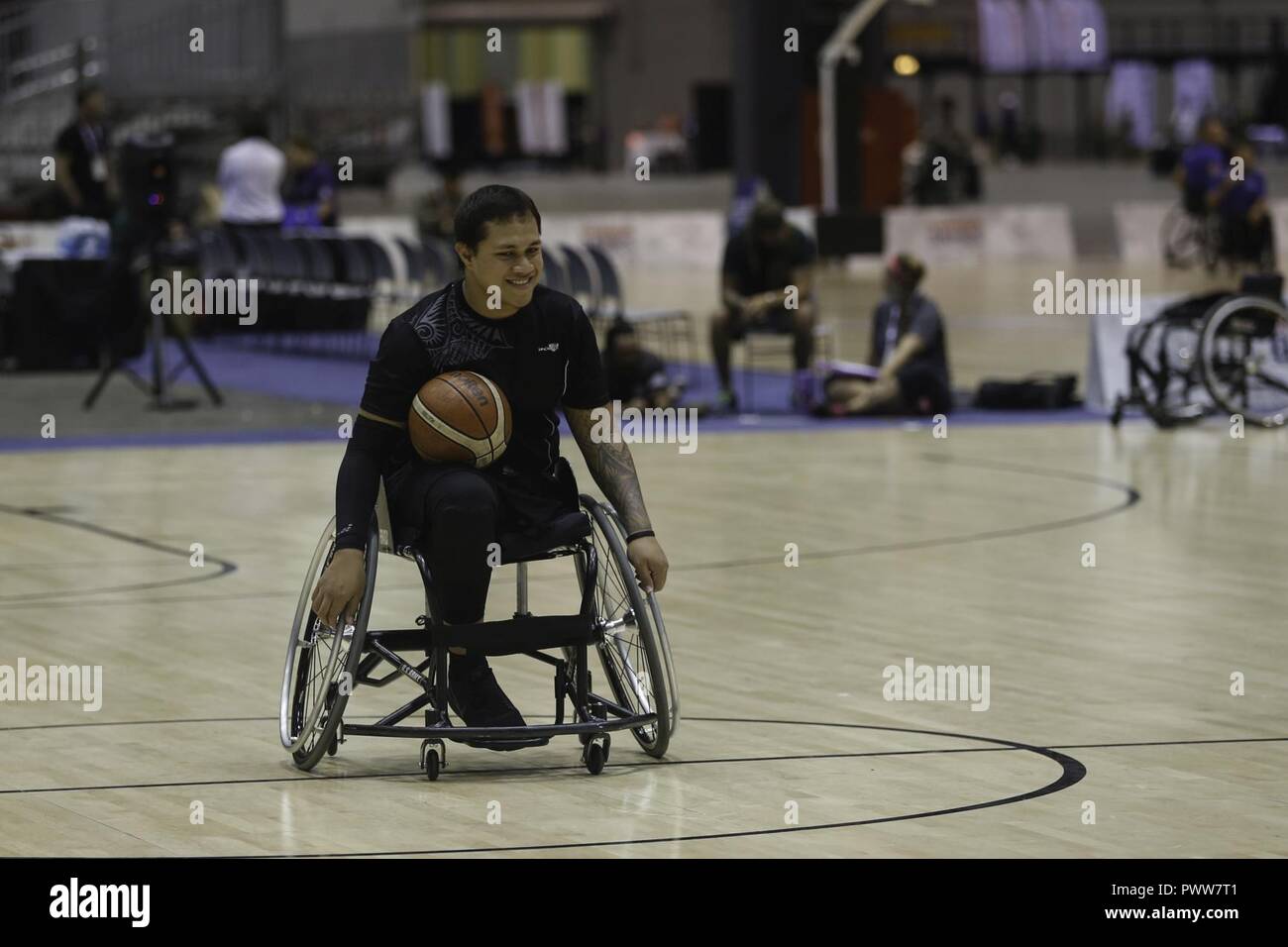 U.S. Army veteran Jarred Vaina practices wheelchair basketball for the 2017 Department of Defense Warrior Games at Chicago, Ill., June 29, 2017. The DOD Warrior Games are an annual event allowing wounded, ill and injured service members and veterans in Paralympic-style sports including archery, cycling, field, shooting, sitting volleyball, swimming, track and wheelchair basketball. Stock Photo