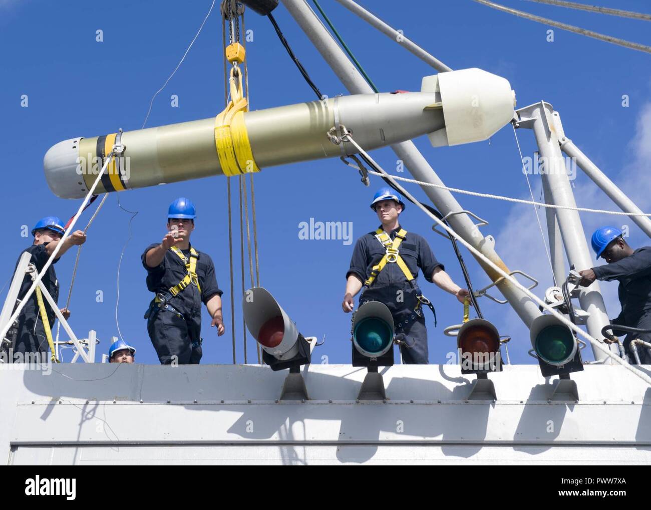 WATERS OFF GUAM (June 28, 2017) Sailors hoist an MK 46 torpedo from the ...