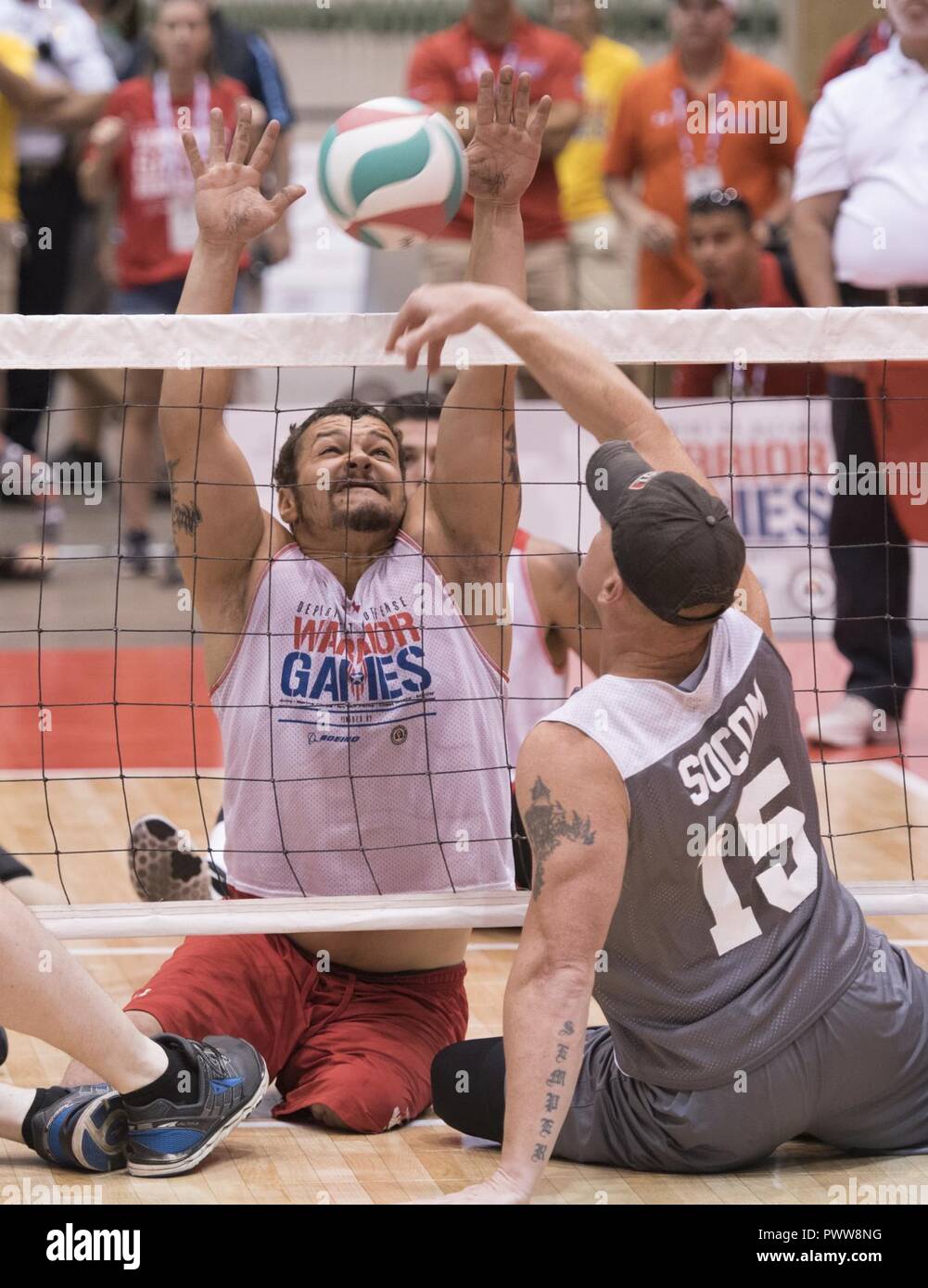 https://c8.alamy.com/comp/PWW8NG/marine-corps-veteran-lcpl-matthew-grashen-tries-to-block-a-shot-from-socom-msgt-benjamin-brodt-during-their-sitting-volleyball-game-at-the-2017-department-of-defense-warrior-games-in-chicago-ill-july-1-2017-the-dod-warrior-games-are-an-annual-event-allowing-wounded-ill-and-injured-service-members-and-veterans-to-compete-in-paralympic-style-sports-including-archery-cycling-field-shooting-sitting-volleyball-swimming-track-and-wheelchair-basketball-PWW8NG.jpg