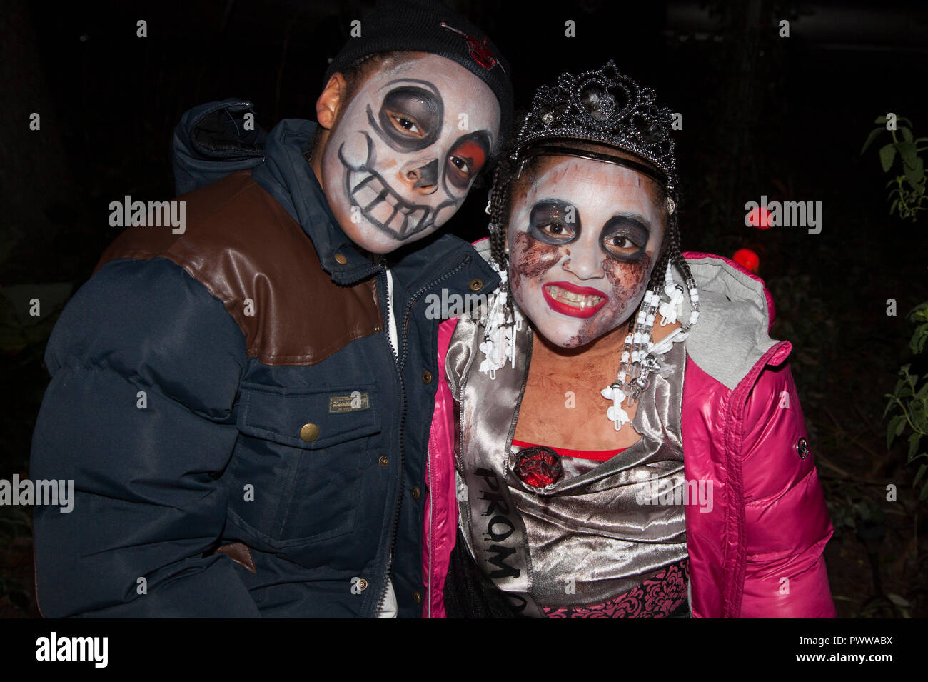 Mexican American couple costumed for 'Day of the Dead' 'Dia de Los Muertos' out for a night of Halloween tricks or treats. St Paul Minnesota MN USA Stock Photo