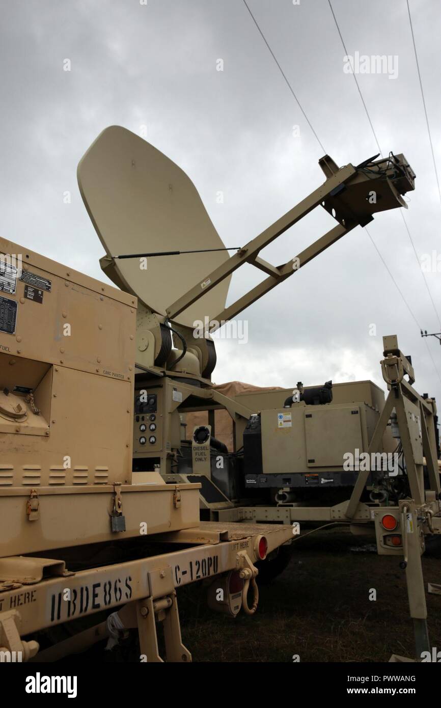 A Satellite Transportable Terminal from the 86th Expeditionary Signal Battalion, 11th Signal Brigade, setting up to provide communications support to the 30th Medical Brigade in Cincu, Romania, July 3, 2017. The 86th Expeditionary Signal Bn. from Fort Bliss, Texas is augmenting 2nd Theater Signal Brigade with additional tactical signal assets and capability for exercise Saber Guardian 17, a U.S. Army Europe-led, multinational exercise, taking place in Bulgaria, Hungary and Romania July 11-20, 2017. Stock Photo