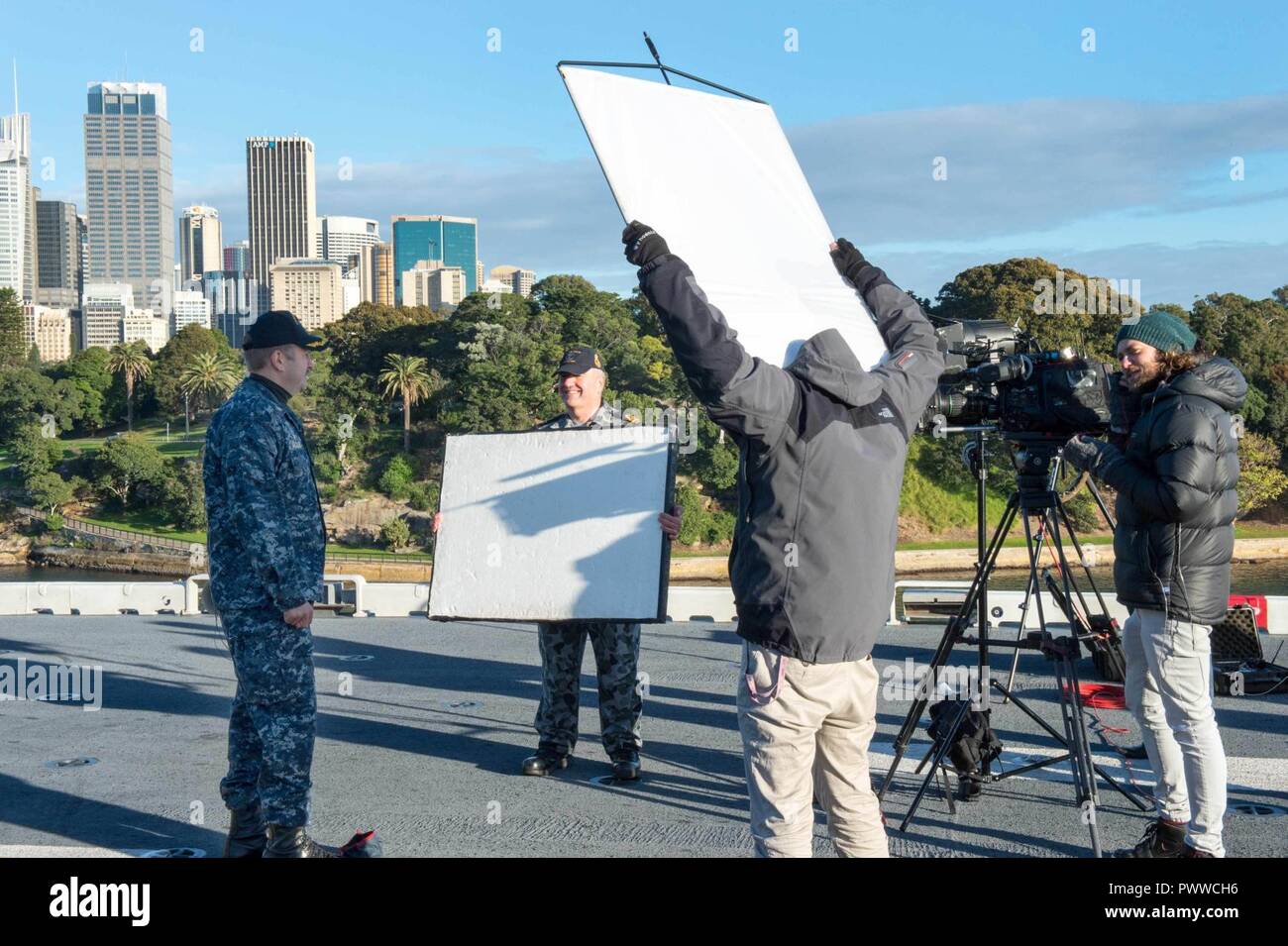 https://c8.alamy.com/comp/PWWCH6/sydney-july-1-2017-capt-larry-mccullen-commanding-officer-of-the-amphibious-assault-ship-uss-bonhomme-richard-lhd-6-speaks-with-the-hosts-of-9news-an-australian-television-morning-show-from-the-ships-flight-deck-during-a-live-broadcast-bonhomme-richard-made-a-port-call-to-sydney-as-part-of-talisman-saber-2017-which-is-a-biennial-us-australia-bilateral-military-exercise-that-combines-a-field-training-exercise-and-command-post-exercise-to-strengthen-interoperability-and-response-capabilities-to-uphold-the-tenets-of-the-us-australian-alliance-PWWCH6.jpg