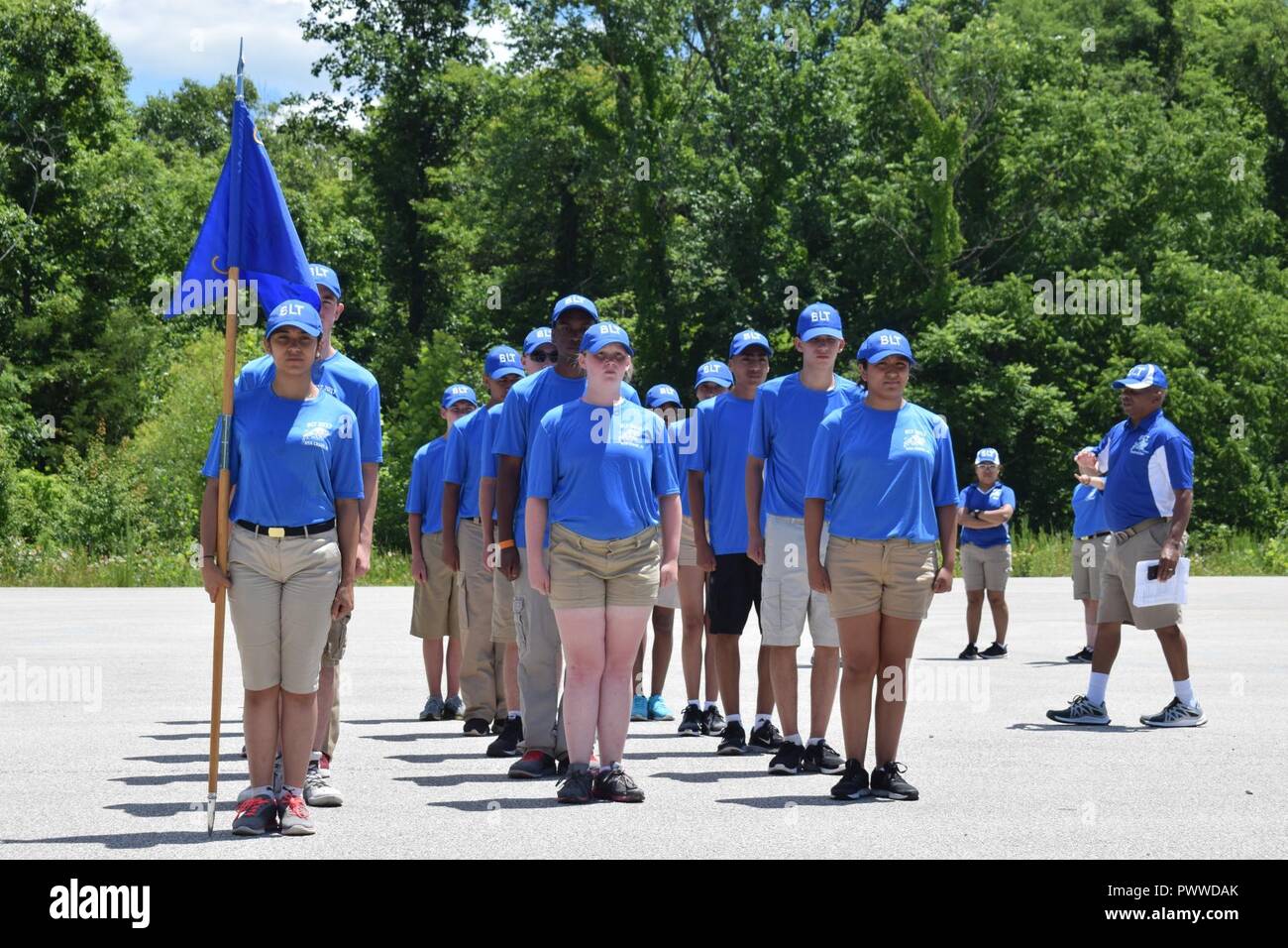 Navy Junior ROTC cadets practice military drill techniques during the