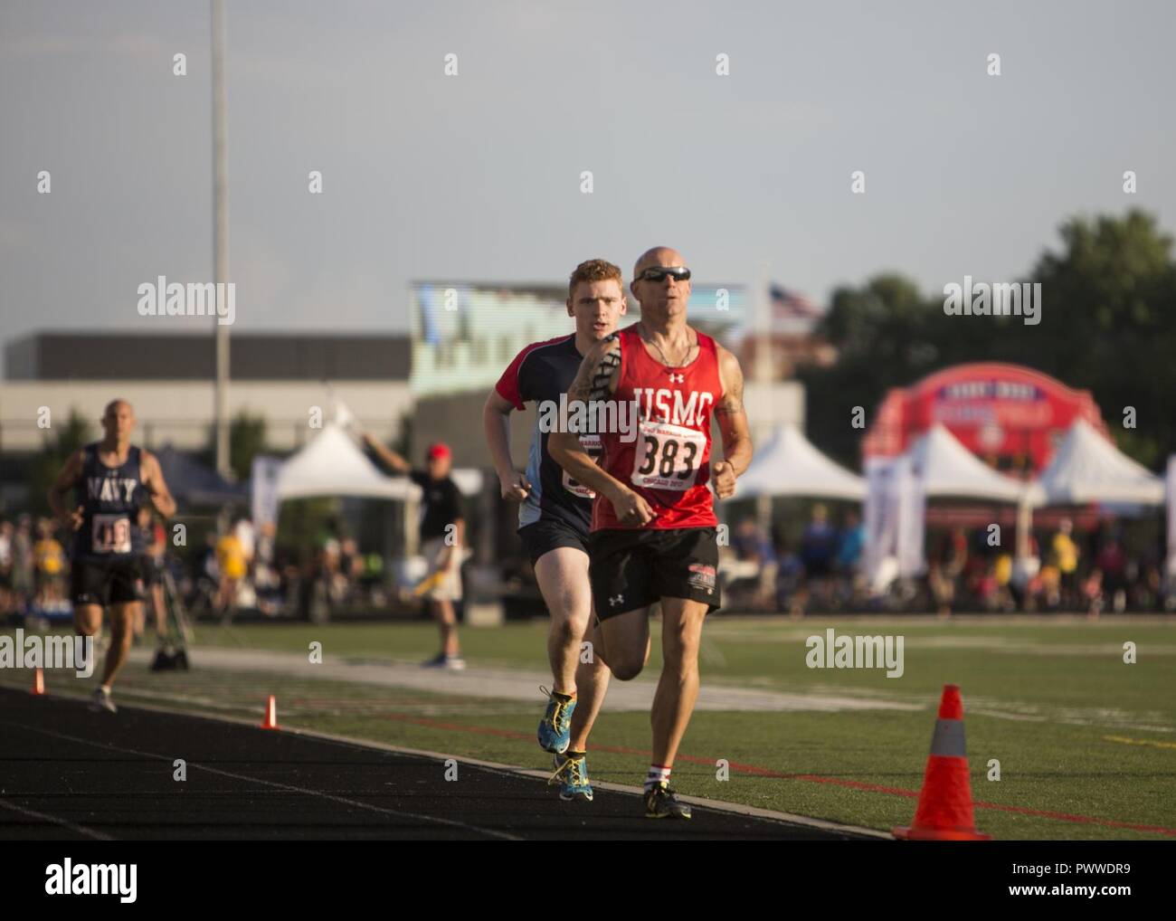 U.S. Marine Corps Sgt. Maj. Brian Fogarty, a member of Team Marine Corps and native of New Philadelphia, Pa., takes the lead in a men’s 1,500-meter race during the 2017 DoD Warrior Games Track Competition at Lane Technical College Preparatory High School in Chicago July 2, 2017.  The DoD Warrior Games is an adaptive sports competition for wounded, ill and injured service members and veterans. Stock Photo