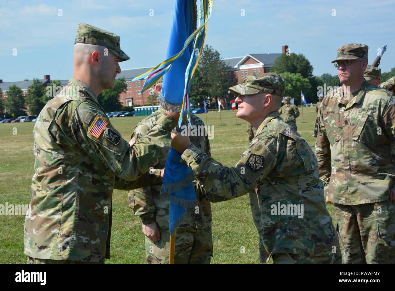 Fort Meade, Md. -- Lt. Col Galen R. Kane, The Outgoing Commander Of The  741St Military Intelligence Battalion Passes The Unit Colors To Col. Rhett  R. Cox, Commander Of The 704Th Mi