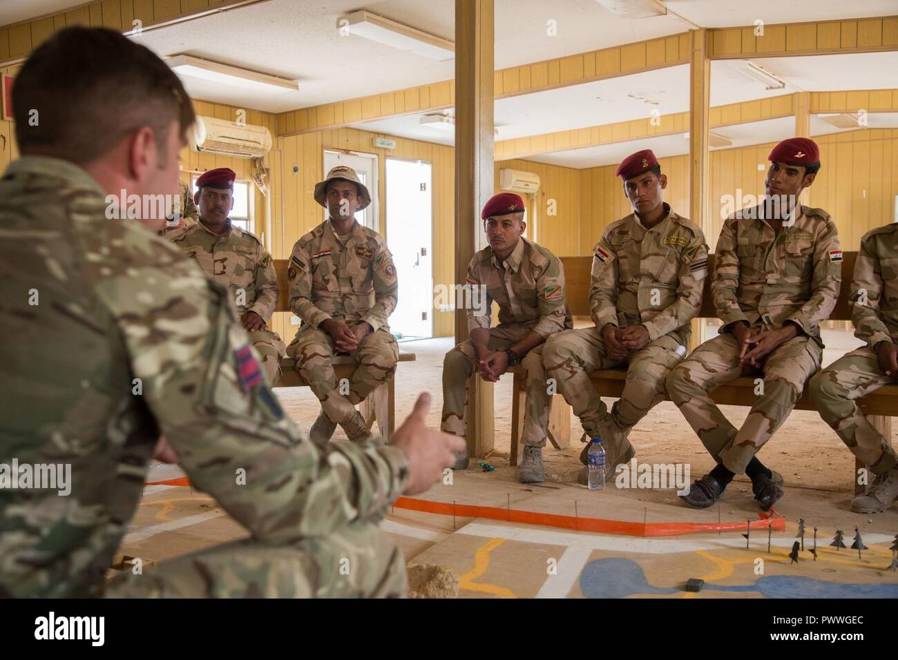 British Trainer Lance Cpl Andrew Shows Iraqi Soldiers Where To Suspect Improvised Explosive Devices On A Map During A Counter I E D Class At Camp Al Asad Iraq July 2 17 This Training