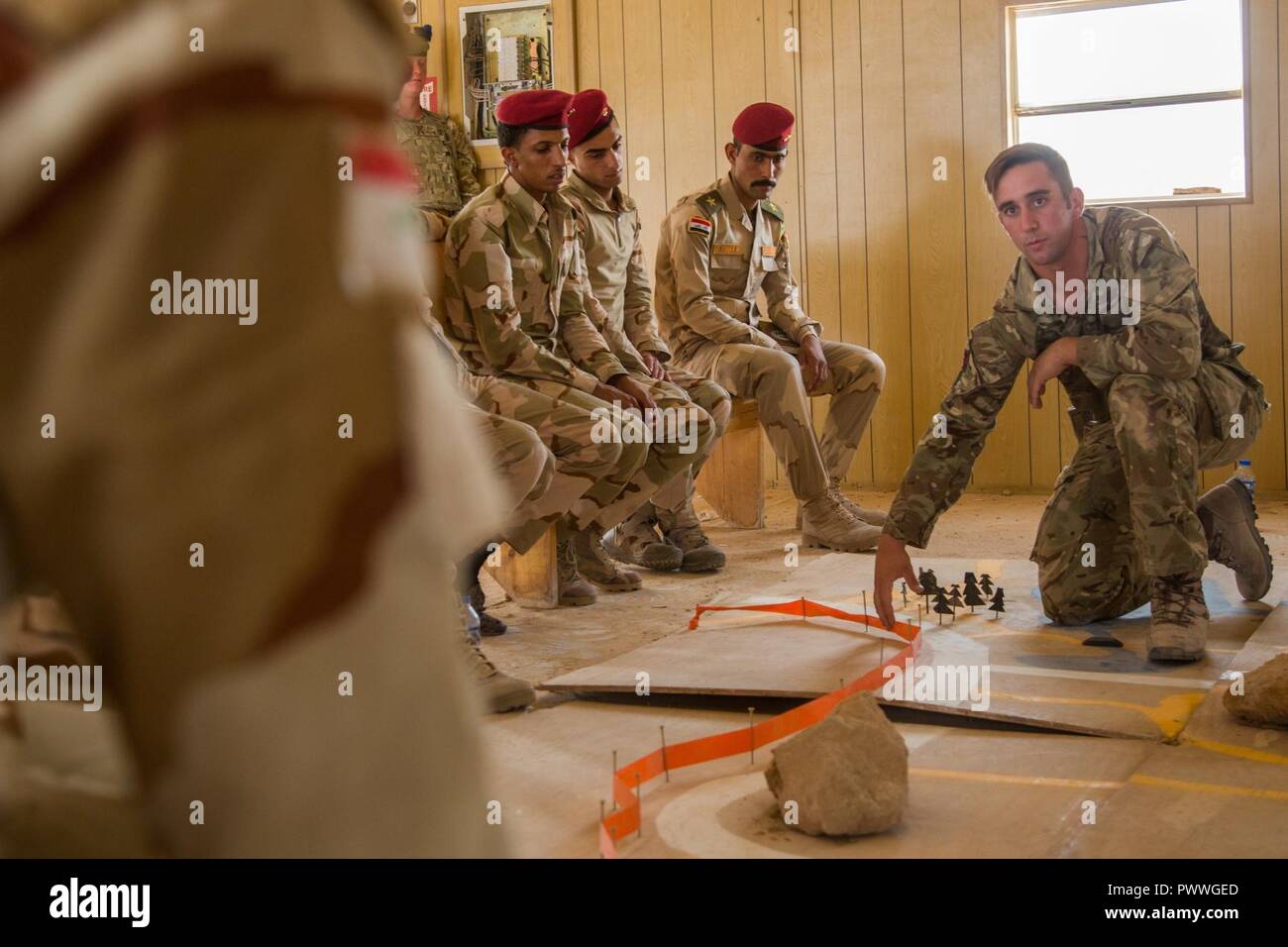 British Trainer Lance Cpl Andrew Shows Iraqi Soldiers Where To Suspect Improvised Explosive Devices On A Map During A Counter I E D Class At Camp Al Asad Iraq July 2 17 This Training