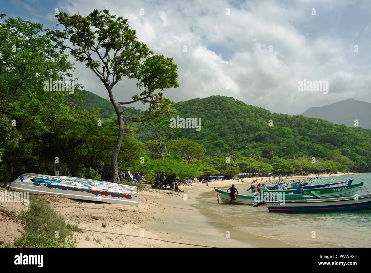 Motor boats parking on the beach. Playa Cristal, Tayrona National Park, Colombia. Sep 2018 Stock Photo