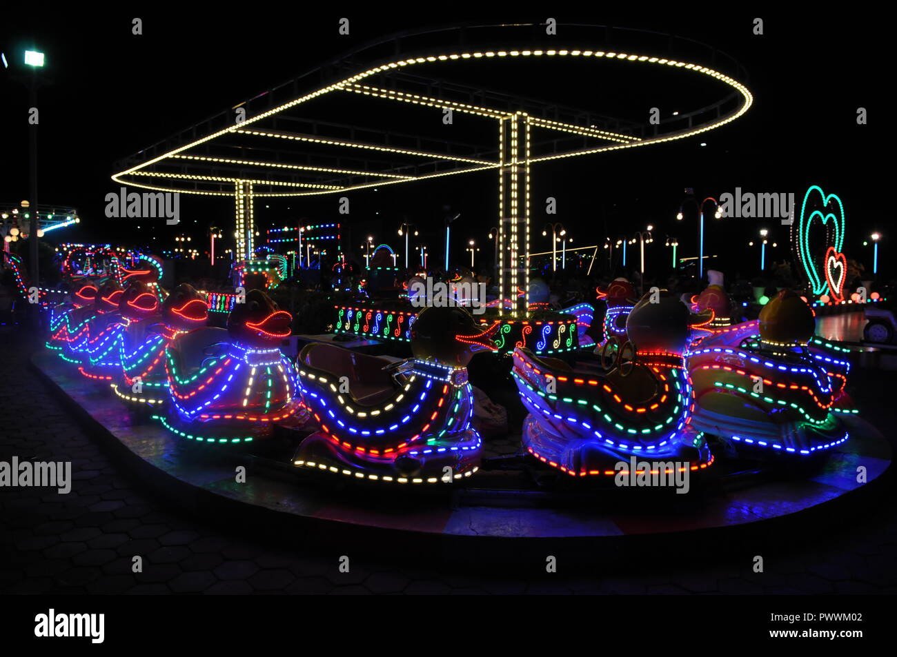 Illuminated duck ride at night. Koh Pich (Diamond Island) amusement ...