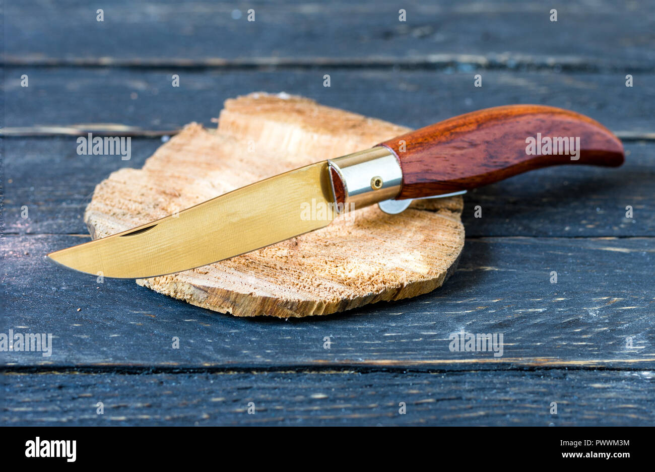 Classic folding knife with a wooden handle. Penknife. Stock Photo