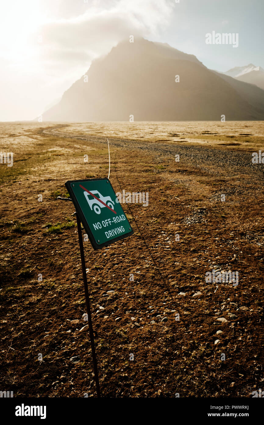 A 'no off-road driving' sign in the remote mountain and plain landscape of south east Iceland. Driving off road damages the delicate tundra moss flora Stock Photo