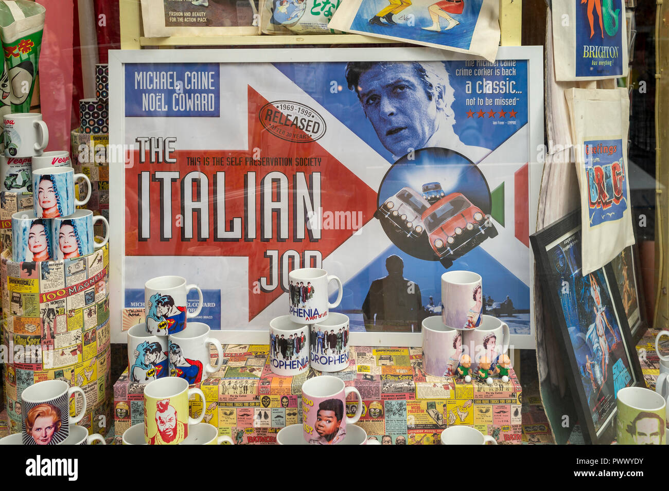 Italian Job film poster and painted mugs in a gift shop window in Brighton UK Stock Photo