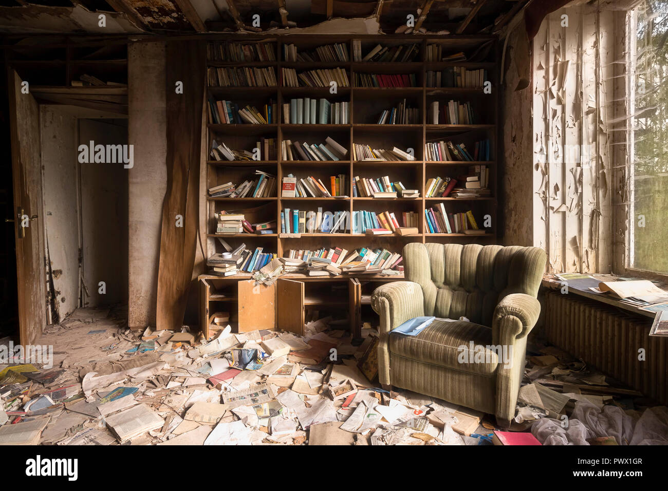 Interior view of a reading room in an abandoned house that was owned by a doctor in Germany. Stock Photo