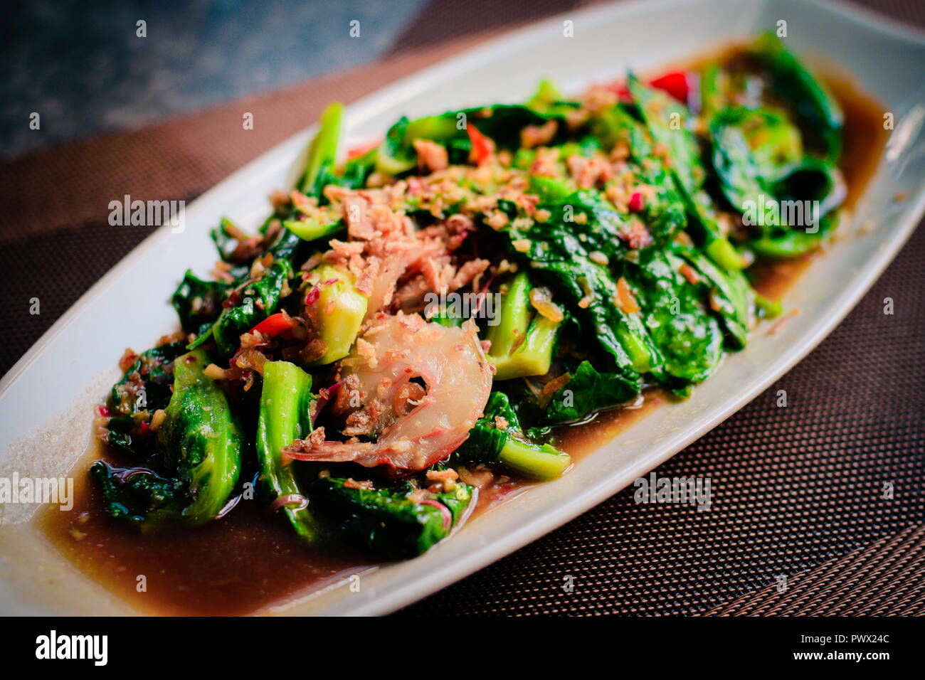 thai Stirfried fresh baby kailan with prawn, garlic and oyster sauce