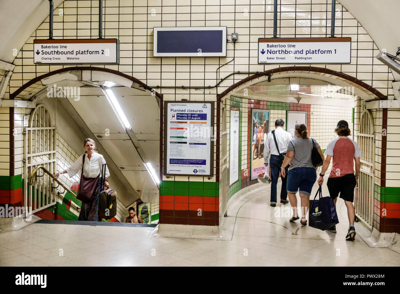 London England,UK,Piccadilly Circus Underground Station train Tube,Bakerloo line,subway tube,platform access stairs,tunnel,man men male,woman female w Stock Photo