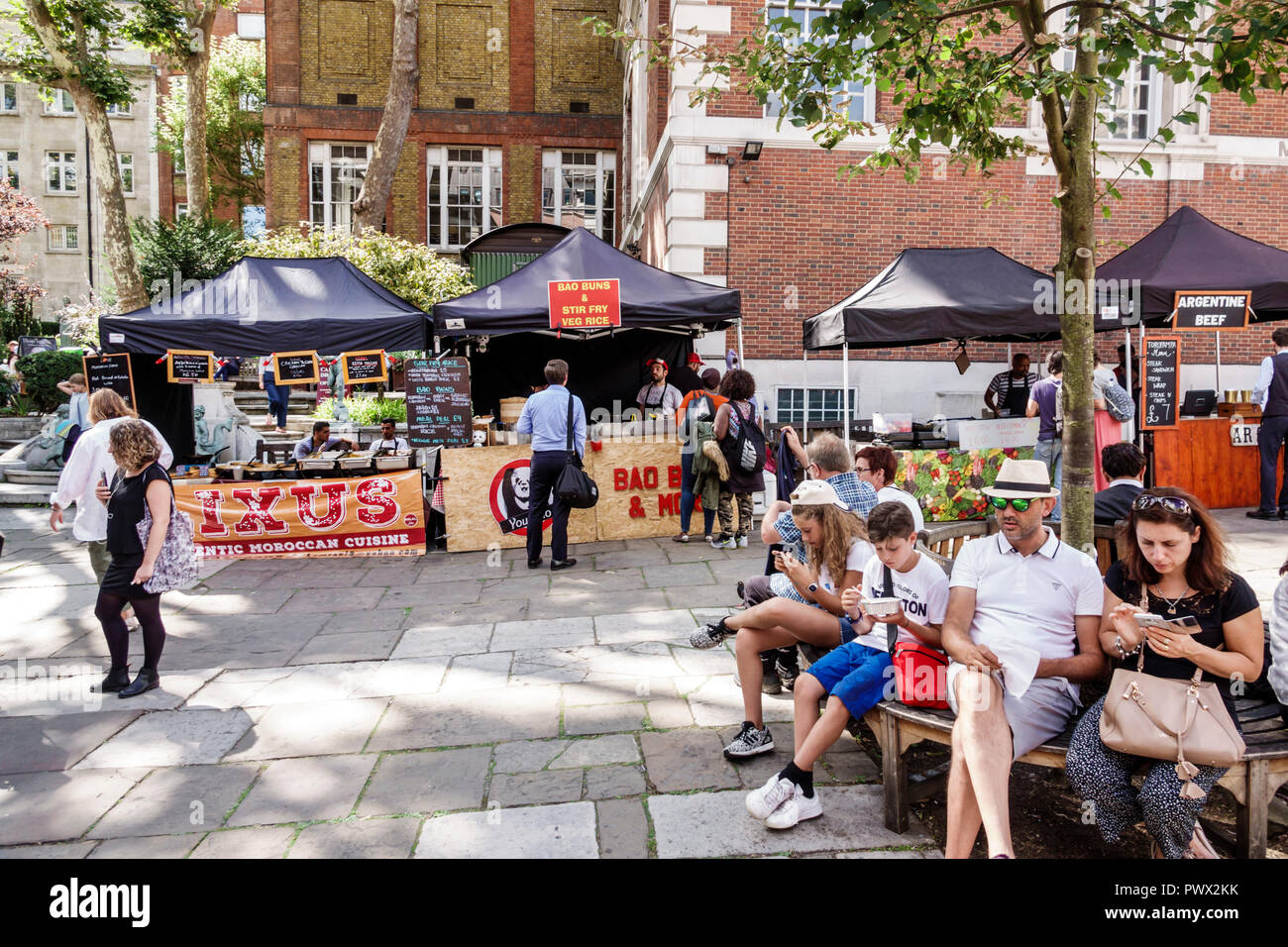 London England,UK,West End St James's Piccadilly Church,St James-in-the-Fields,Anglican Church parish,exterior,Market,food vendor stall,man men male,w Stock Photo