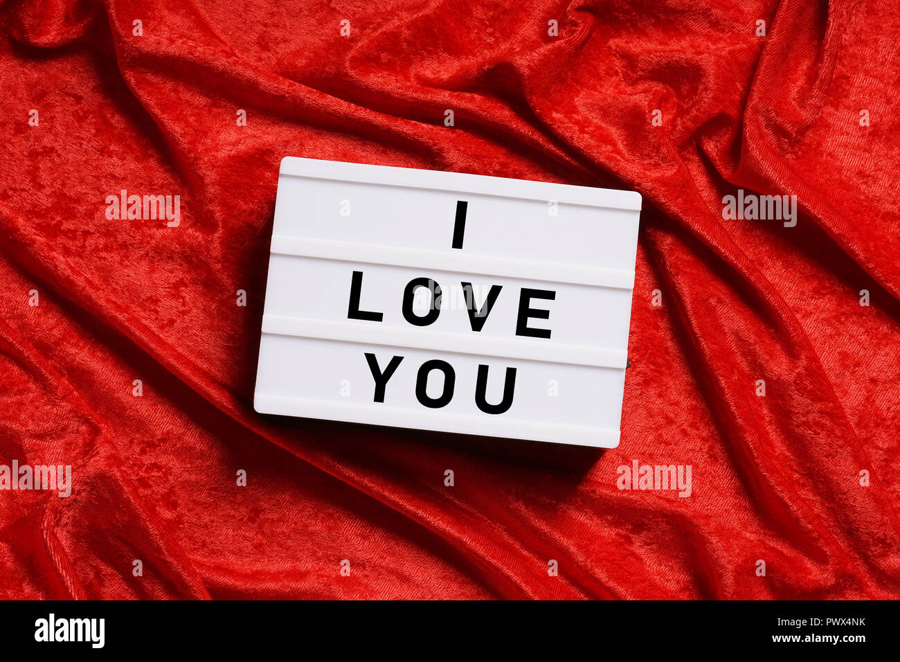 I love you text on lightbox or light box sign on red velvet background Stock Photo