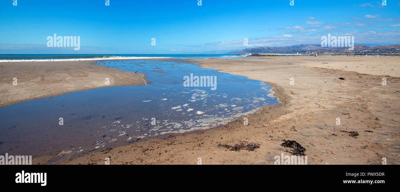 Wave tidal overflow into tide pool on Surfers Knoll beach in Ventura California United States Stock Photo