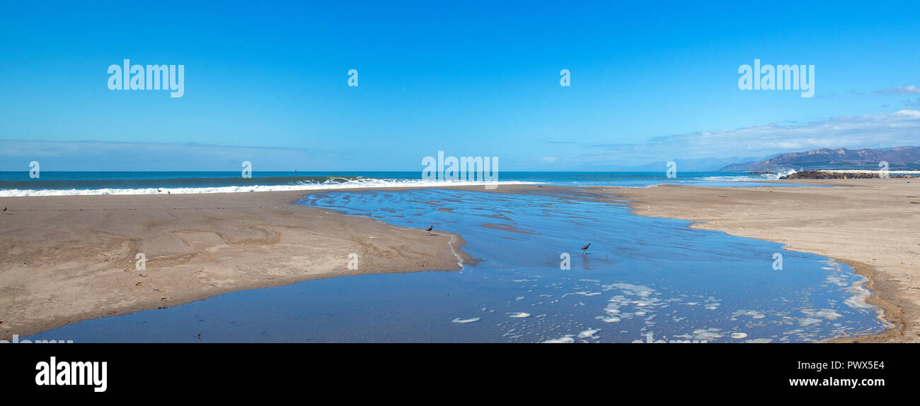 Wave tide overflow into tidal pool on Surfers Knoll beach in Ventura California United States Stock Photo