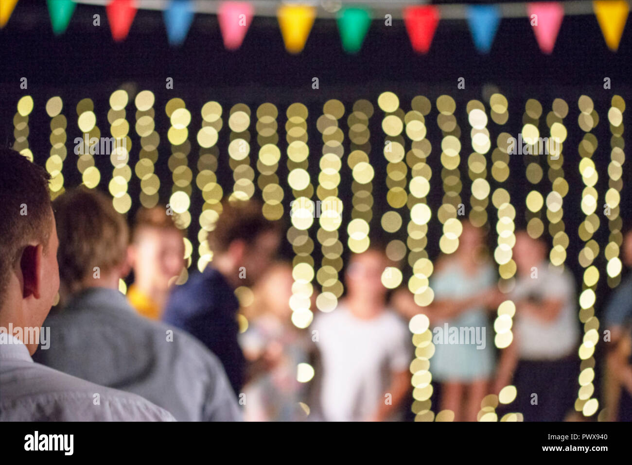 Shiny yellow christmas lights glowing at night. Christmas background ...