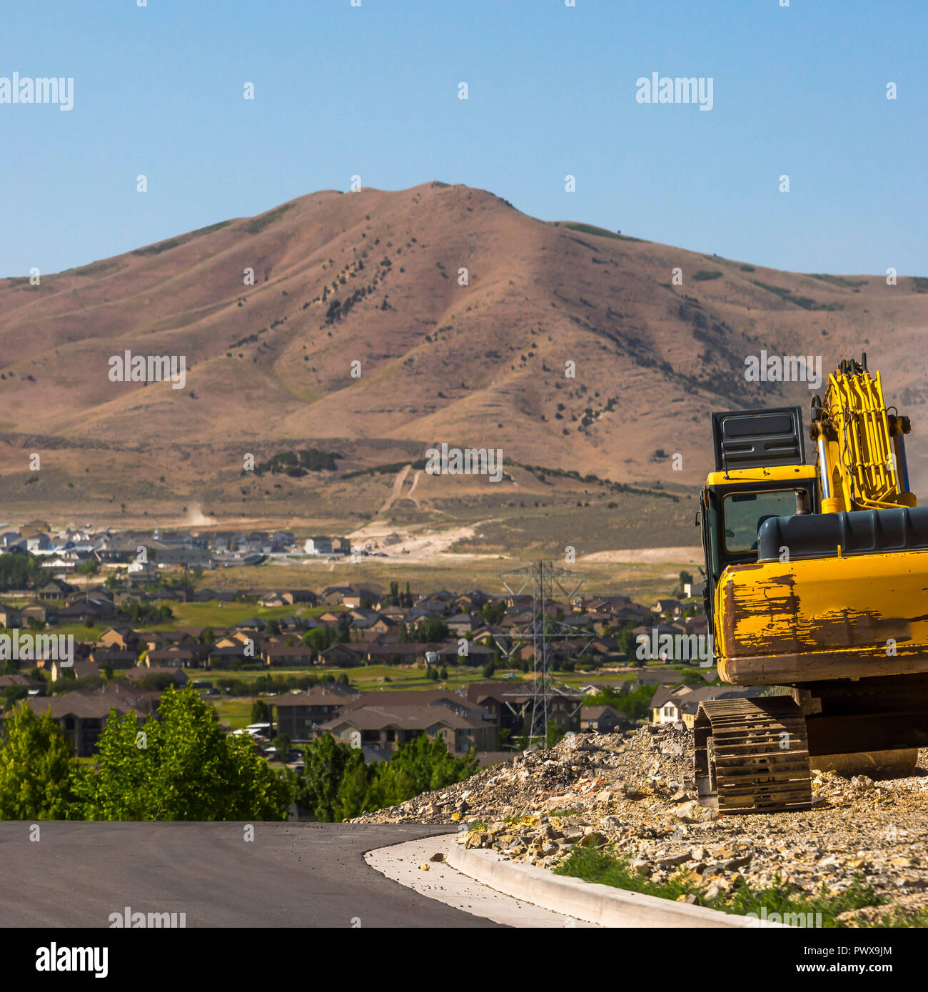 Yellow Excavator on a construction site in Utah Stock Photo - Alamy
