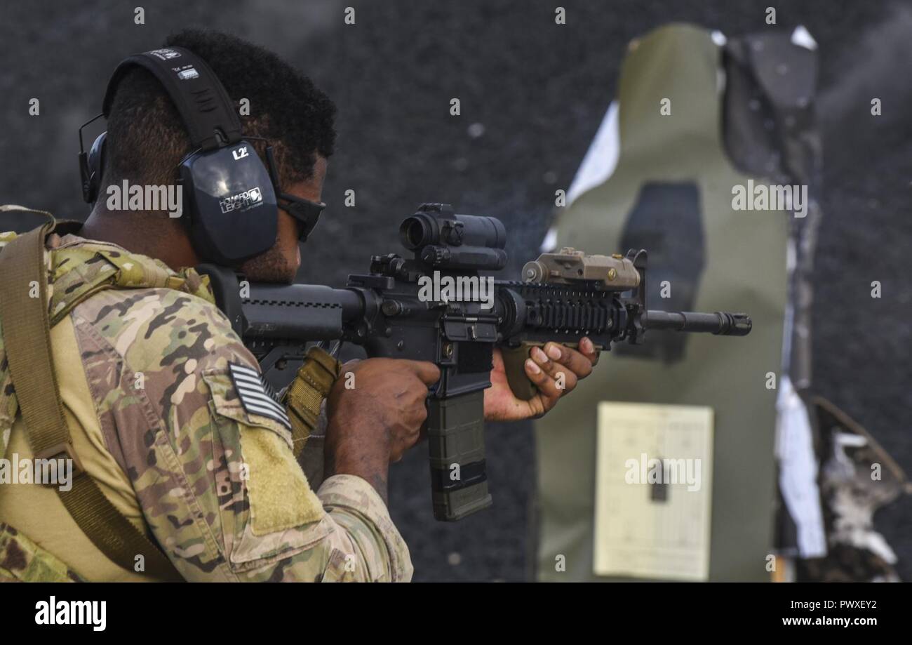 A U.S. Air Force 353rd Special Operations Group deployed aircraft ground response element team member shoots targets during firearms training June 26 2017 at the Hansen Range Camp Hansen Japan.The DAG...