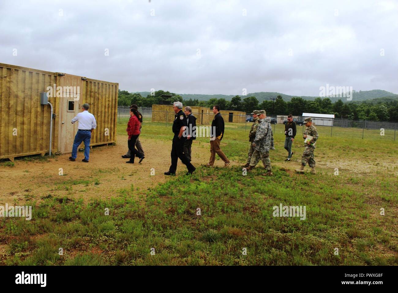 Distinguished visitors (DVs) learn about the Enemy Prisoner of War 2