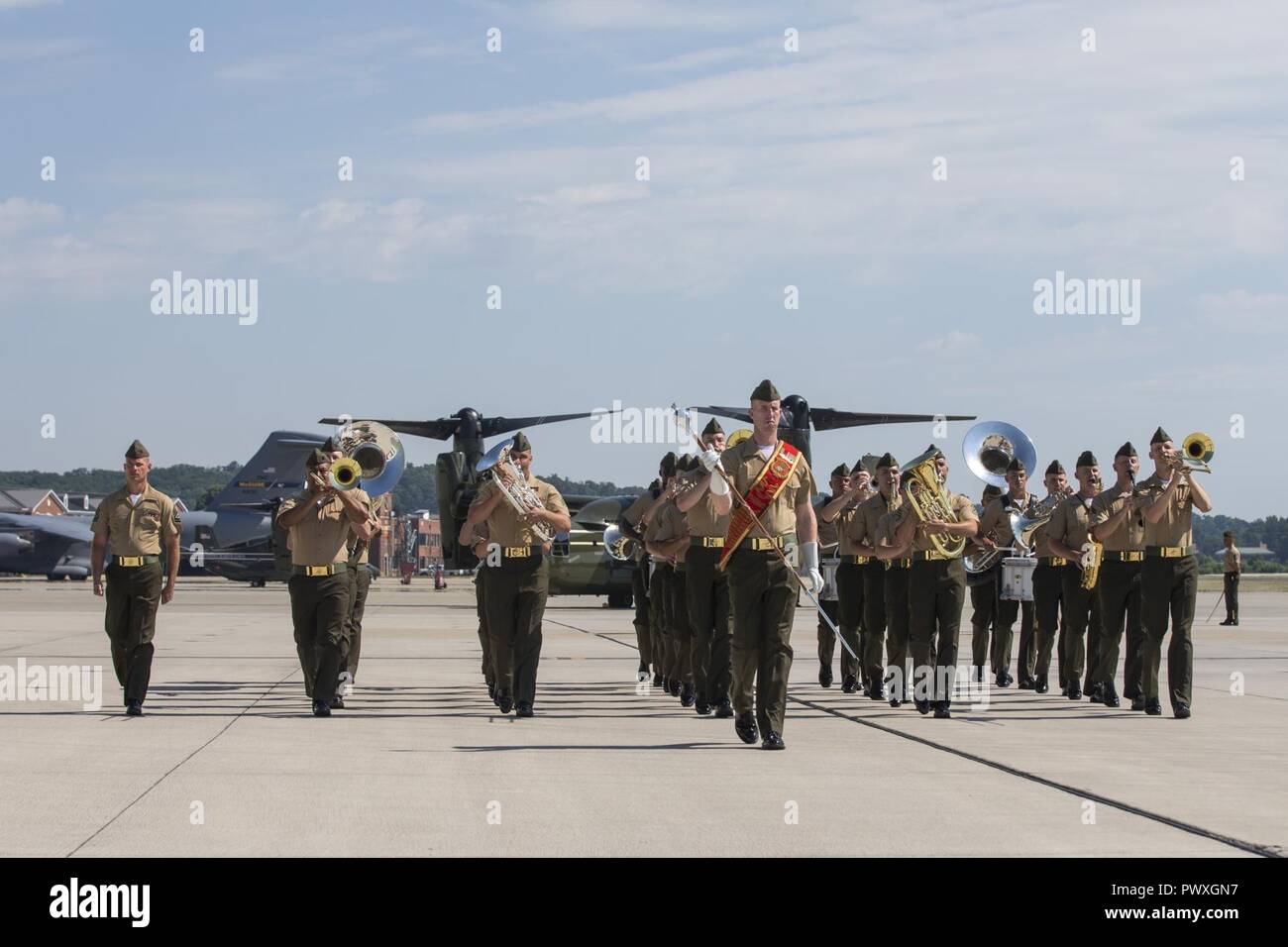 The Quantico Marine Band performs during a change of command ceremony for Helicopter Squadron One (HMX-1) at Marine Corps Base Quantico, Va., June 30, 2017. The ceremony was held to signify the transition of HMX-1 command from U.S. Marine Corps Col. Brian E. Bufton to Col. Garrett R. Hoffman. Stock Photo