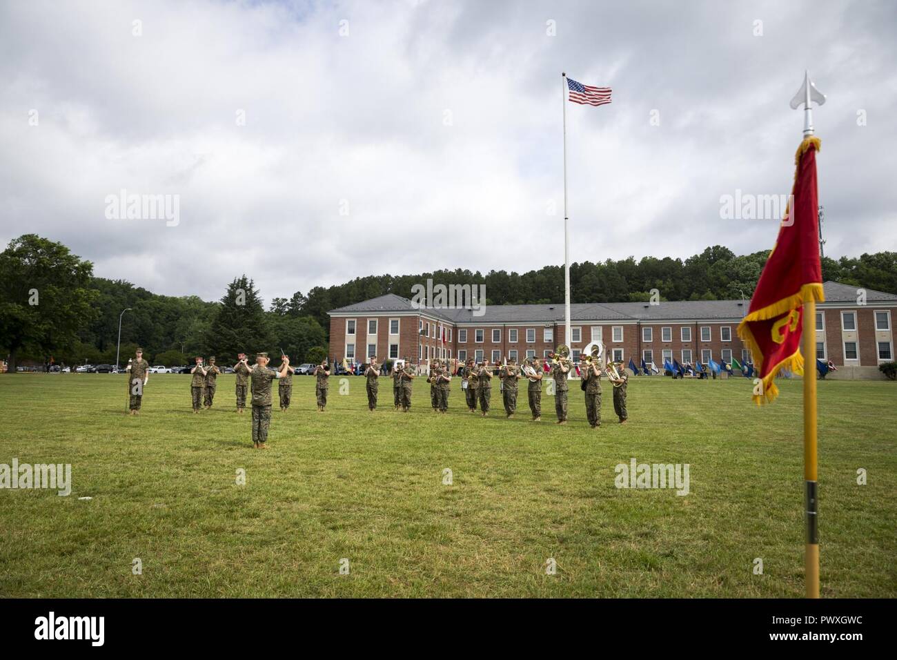 U.S. Marines with the Quantico Marine Band play a tune during a change of command ceremony at Lejeune Hall, Marine Corps Base Quantico, Va., June 23, 2017. During the ceremony, U.S. Marine Corps Col. Todd J. Oneto, outgoing commanding officer, relinquished command to Col. John B. Atkinson, incoming commanding officer. Stock Photo