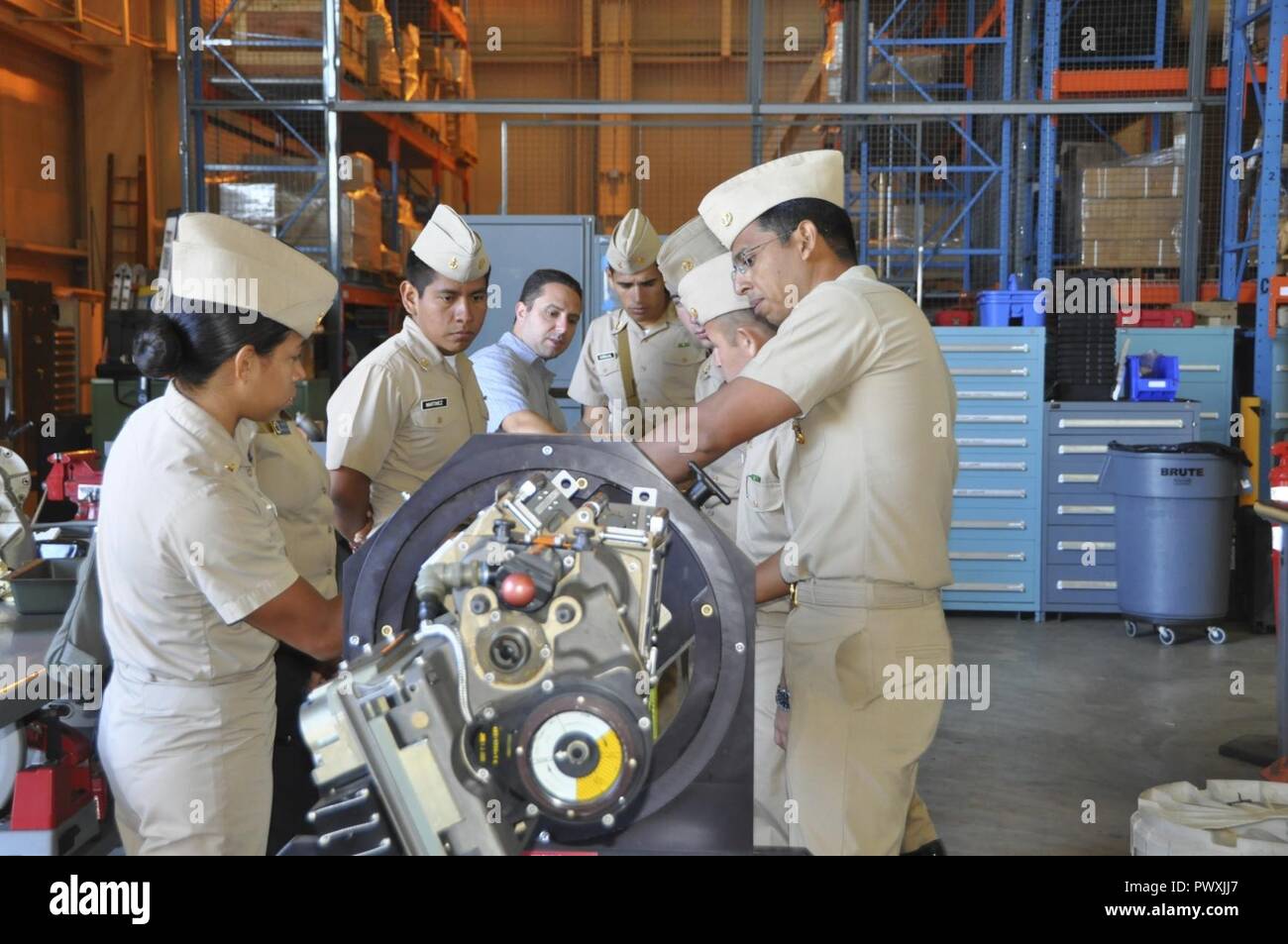 Mission Package Support Facility (MPSF) and Mission Module Readiness Center Director, Andrew Payor (center) and Midshipmen from Mexico’s Naval Academy, Heroica Escuela Naval Military, examine a Mark 44 cannon, part of the Littoral Combat Ship Mission Module 30MM Gun, June 27. The midshipmen also met with subject matter experts at the Underway Replenishment Test Site, Self Defense Test Ship and Surface Warfare Engineering Facility during their tour of Naval Surface Warfare Center Port Hueneme Division. Stock Photo