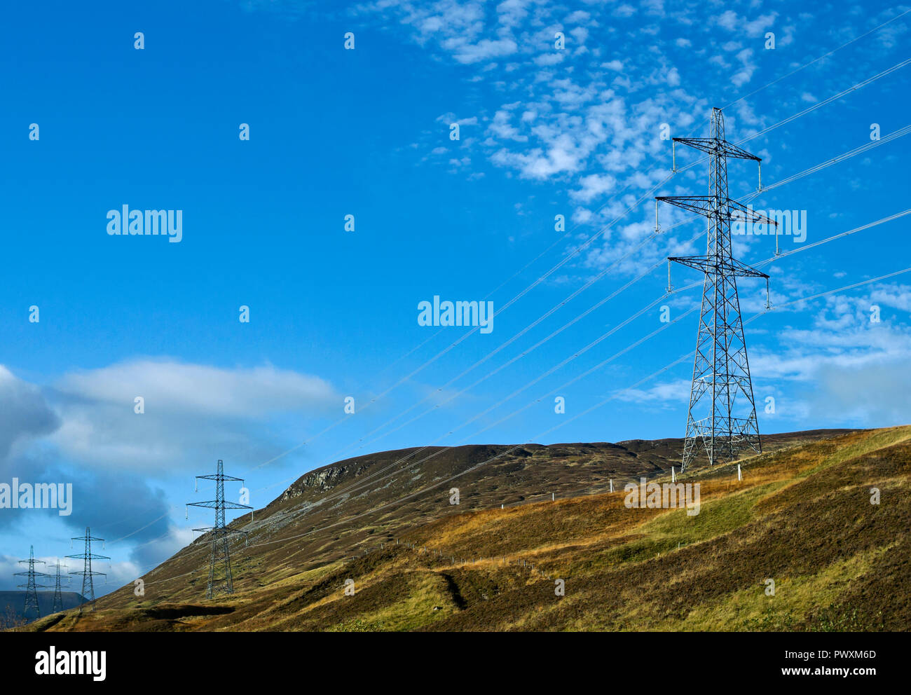 Close-up of intrusive roadside electricity pylons on the A9 trunk road, on hillside near the summit of Drumochter Pass, Scottish Highlands, UK. Stock Photo