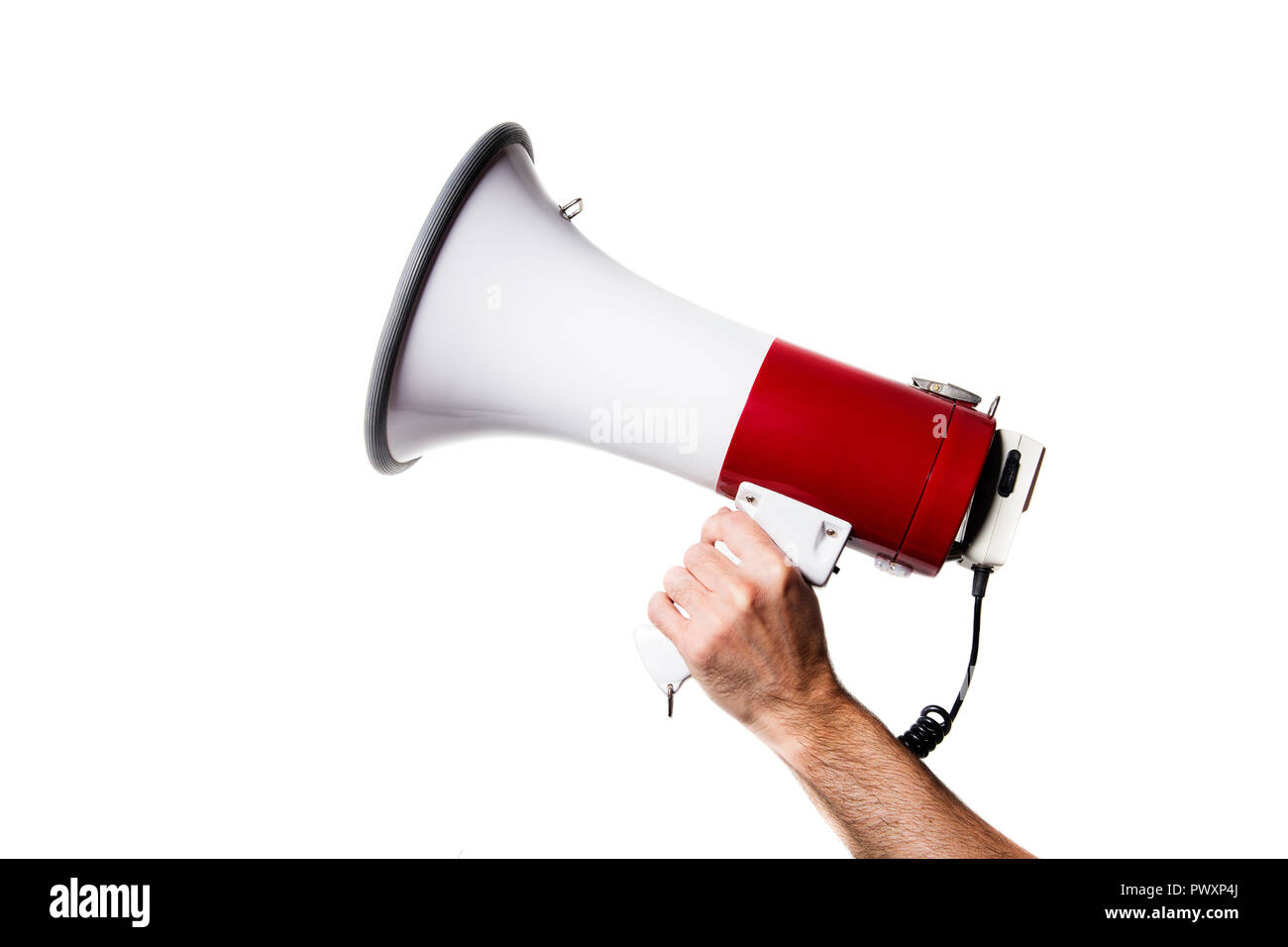 side view of a hand holding a megaphone isolated on white background Stock Photo