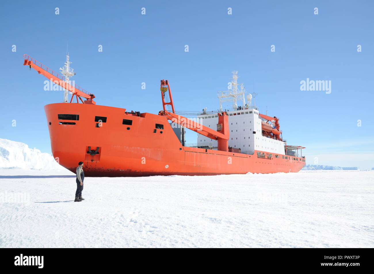 Progress station, Antarctica, January 10, 2017: The cargo ship costs at the floe under unloading. Antarctic. Stock Photo