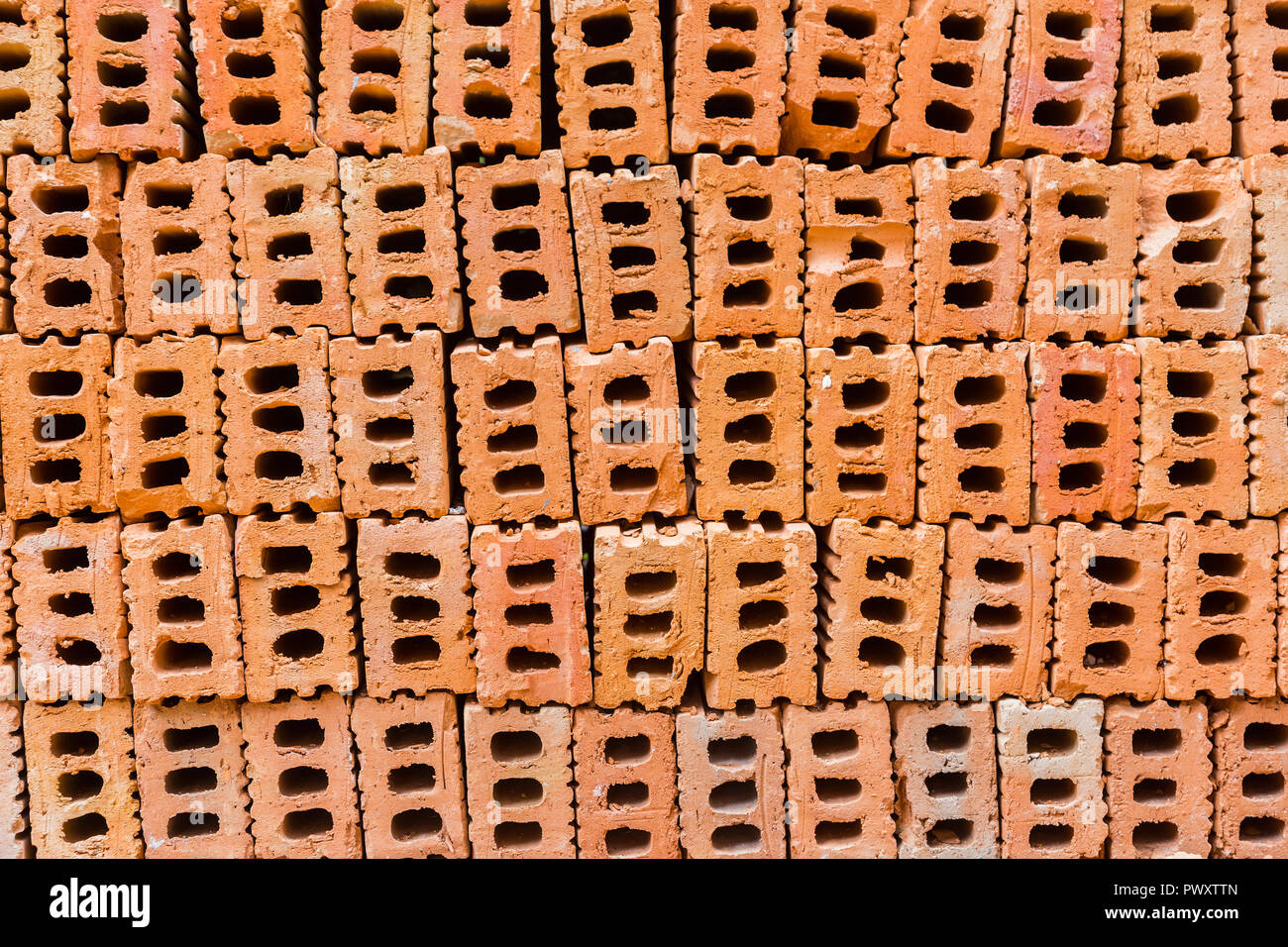 pile of construction bricks, showing holes in the middle Stock Photo