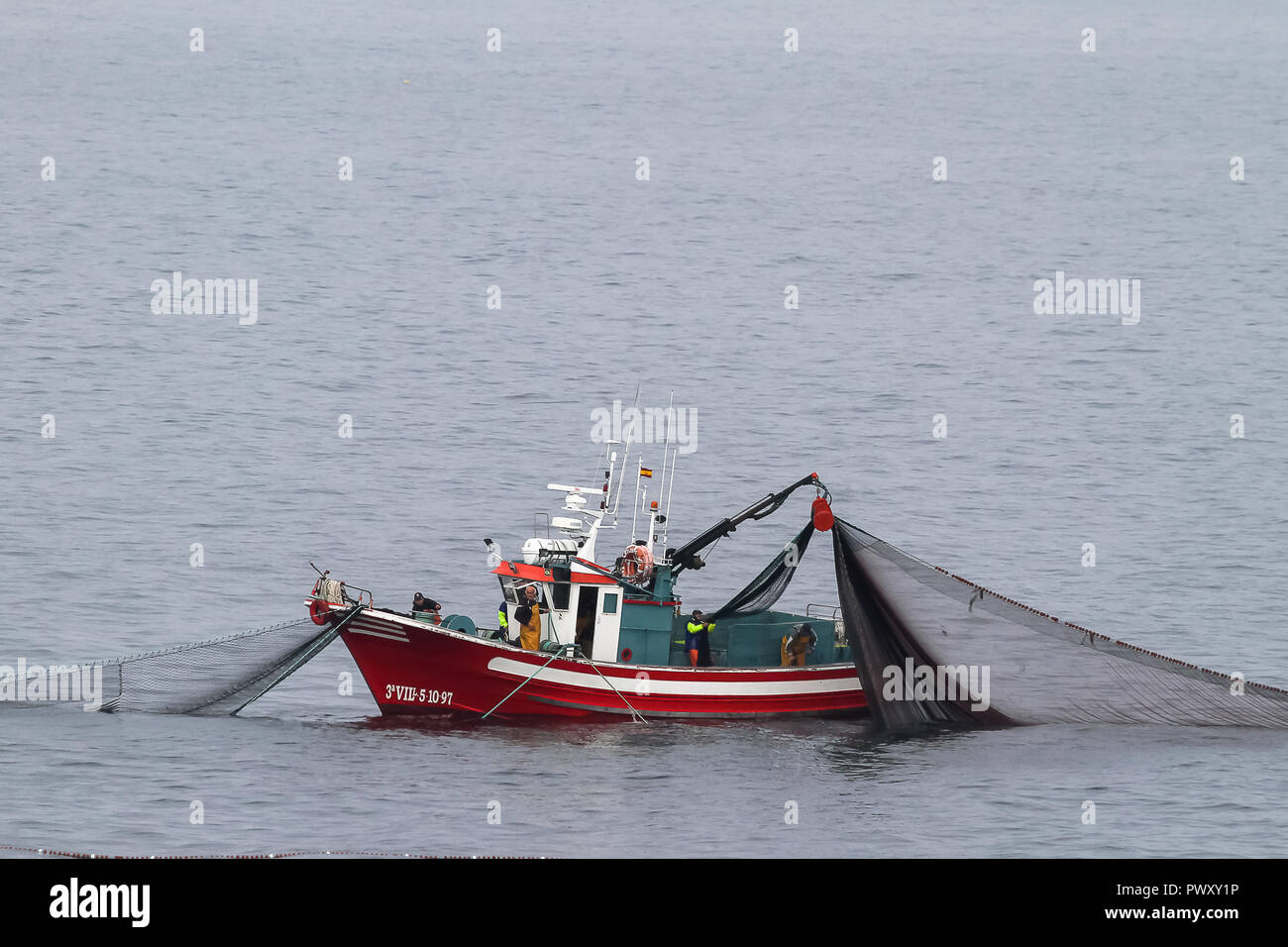 An exotic purse seine fishing boat called a Prahu Madura is docked