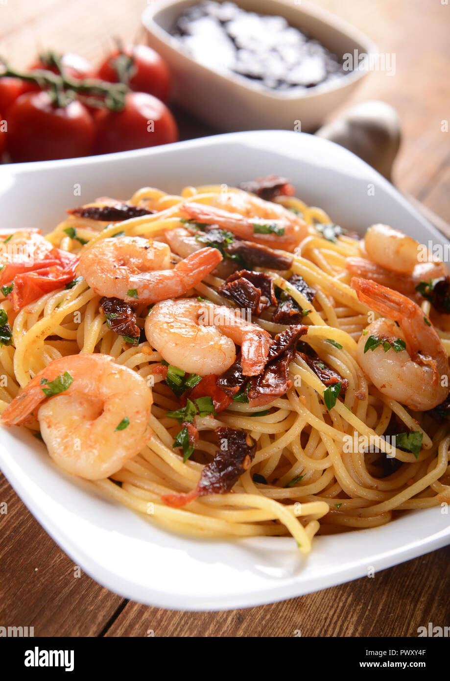 Pasta with prawns and tomatoes Stock Photo - Alamy