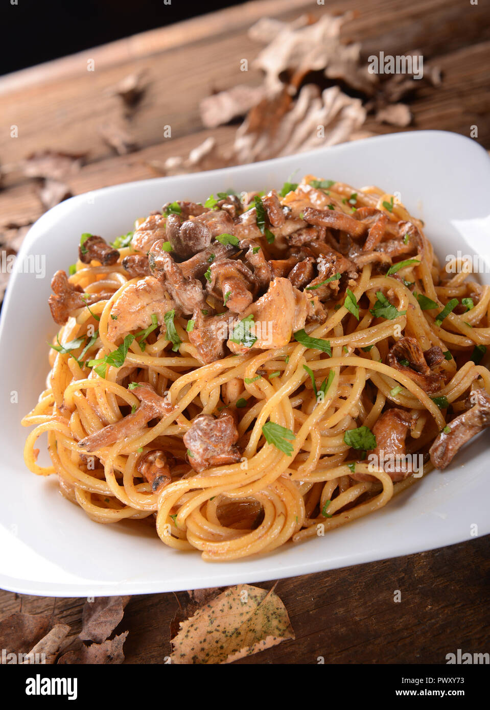 Pasta with chanterelles mushrooms and chicken Stock Photo Alamy